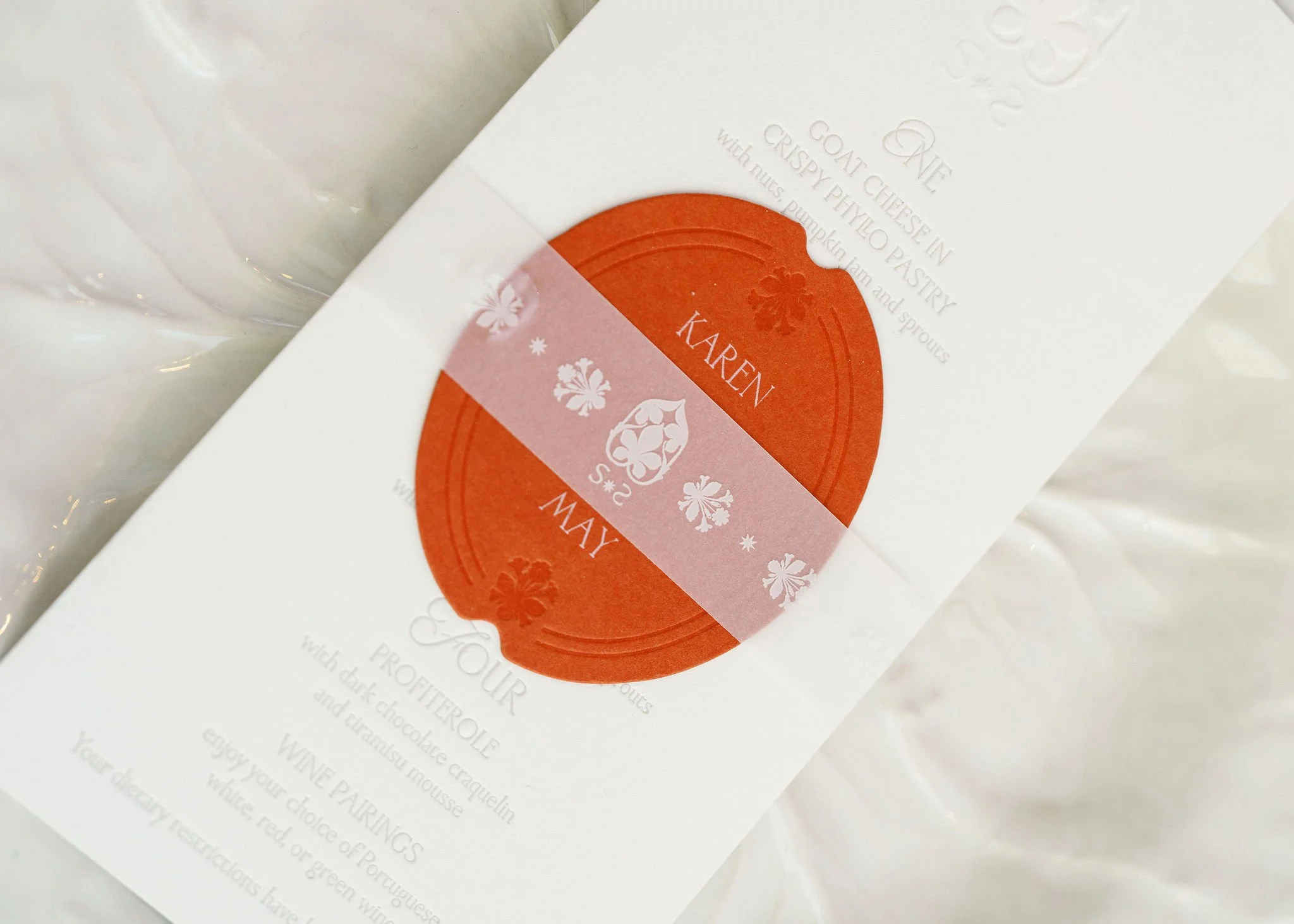 Custom illustrated favor box designed by Merci Studio as part of bespoke event branding.