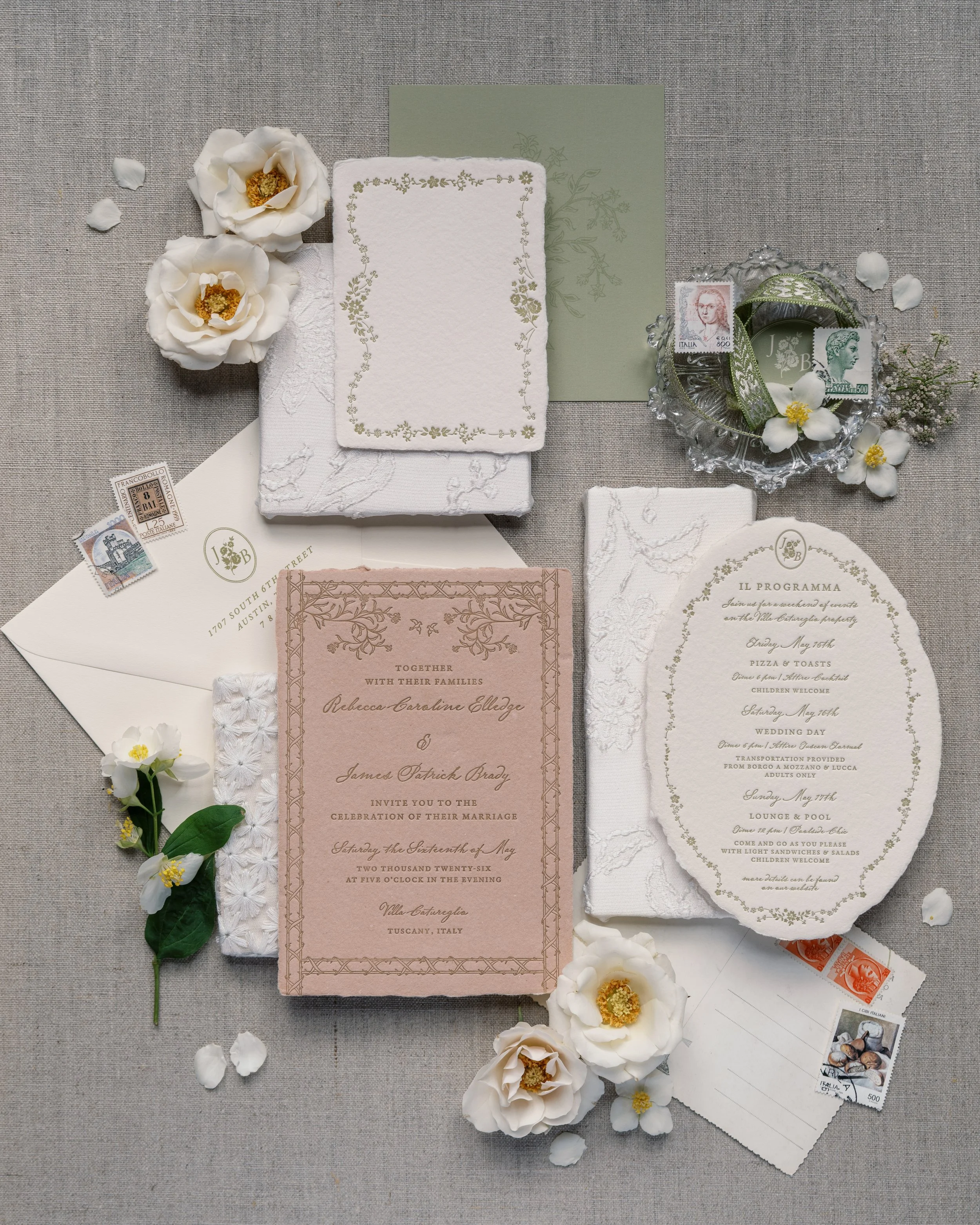 Bespoke wedding invitation suite with custom artwork, stamps, and botanical details by Merci Studio.