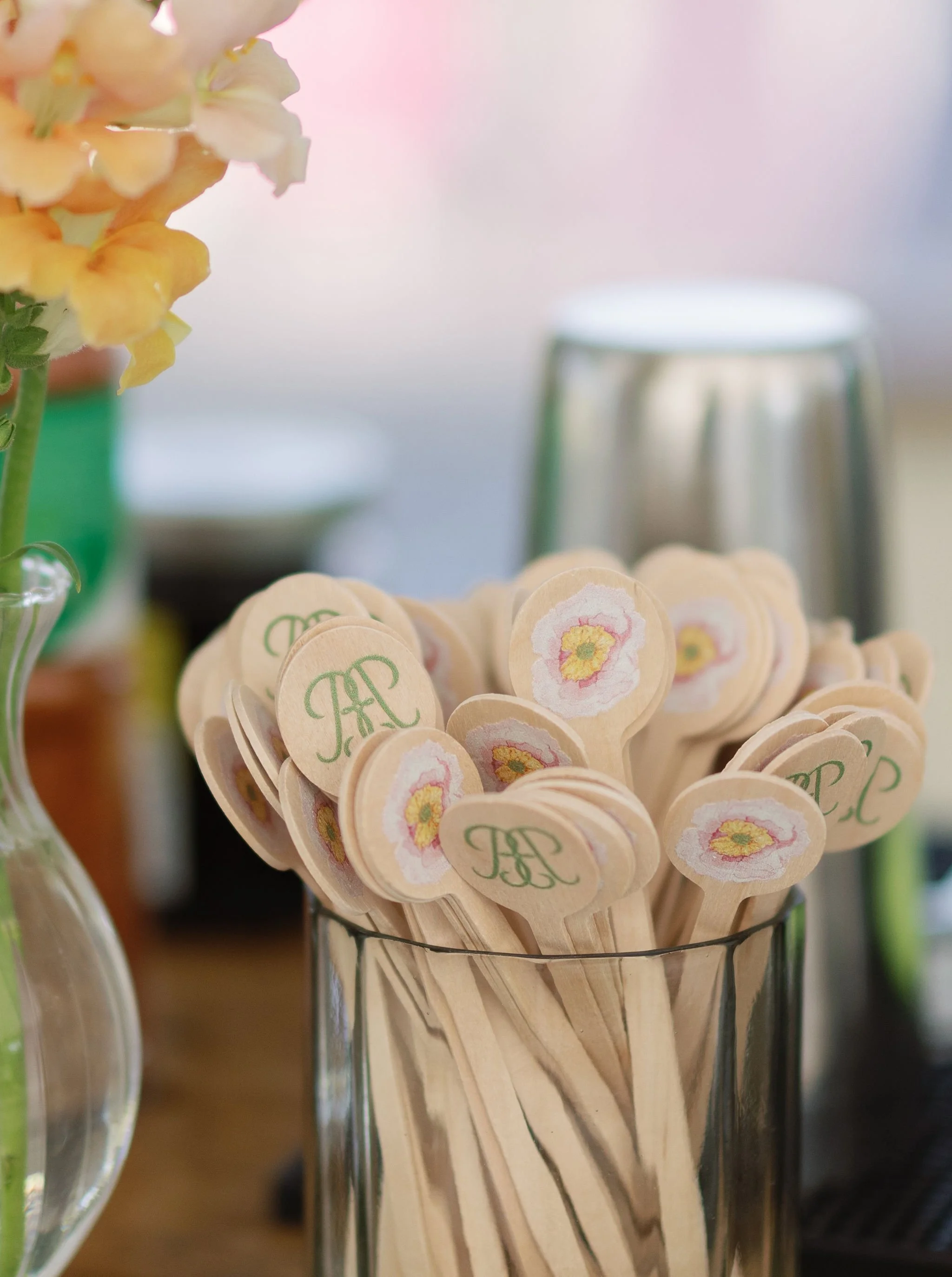 Custom floral tags with monogram artwork designed by Merci Studio for Brianna and Bryce’s wedding.