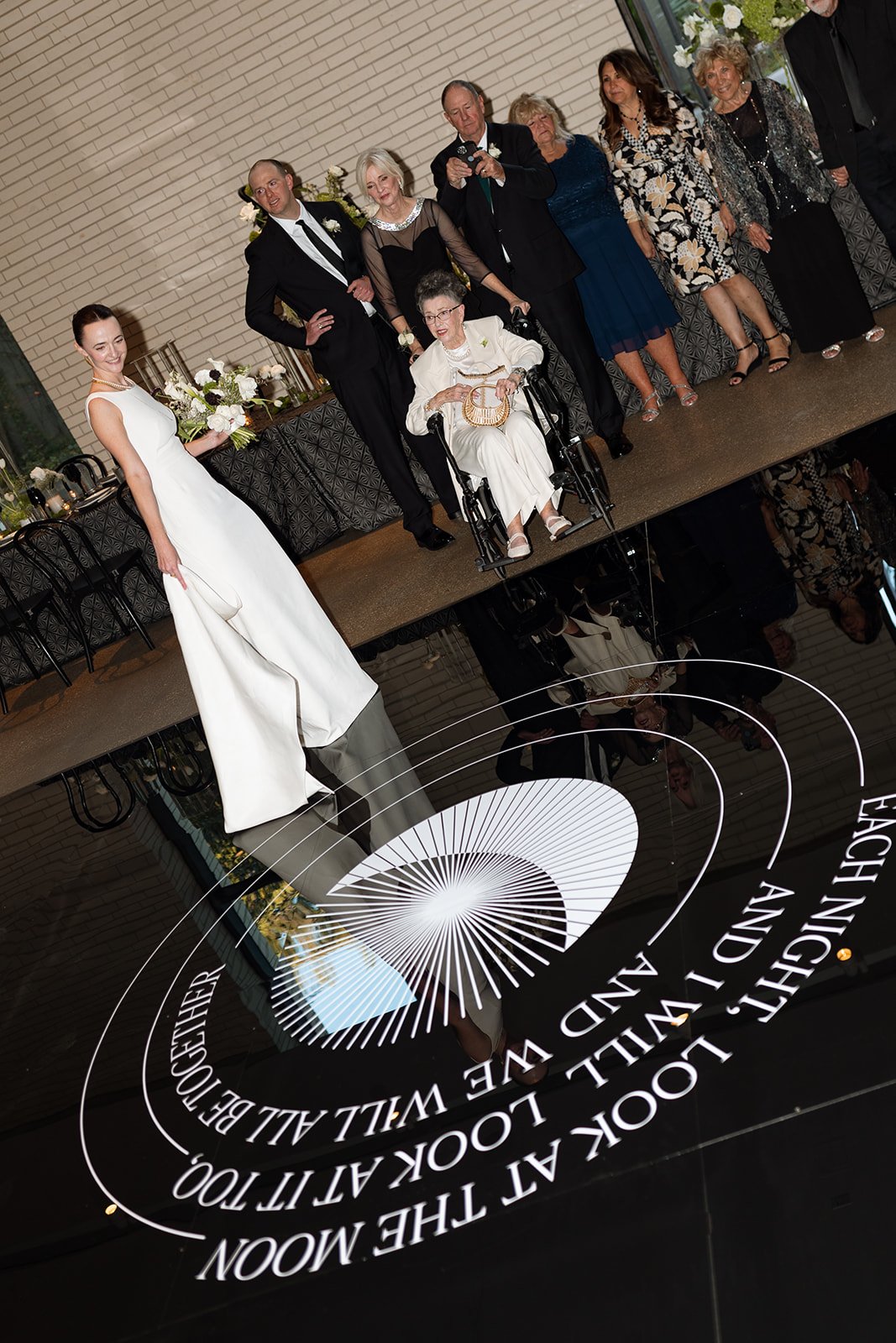 Kristen and Cameron’s wedding celebration with the bride, family, and guests gathered at the reception.