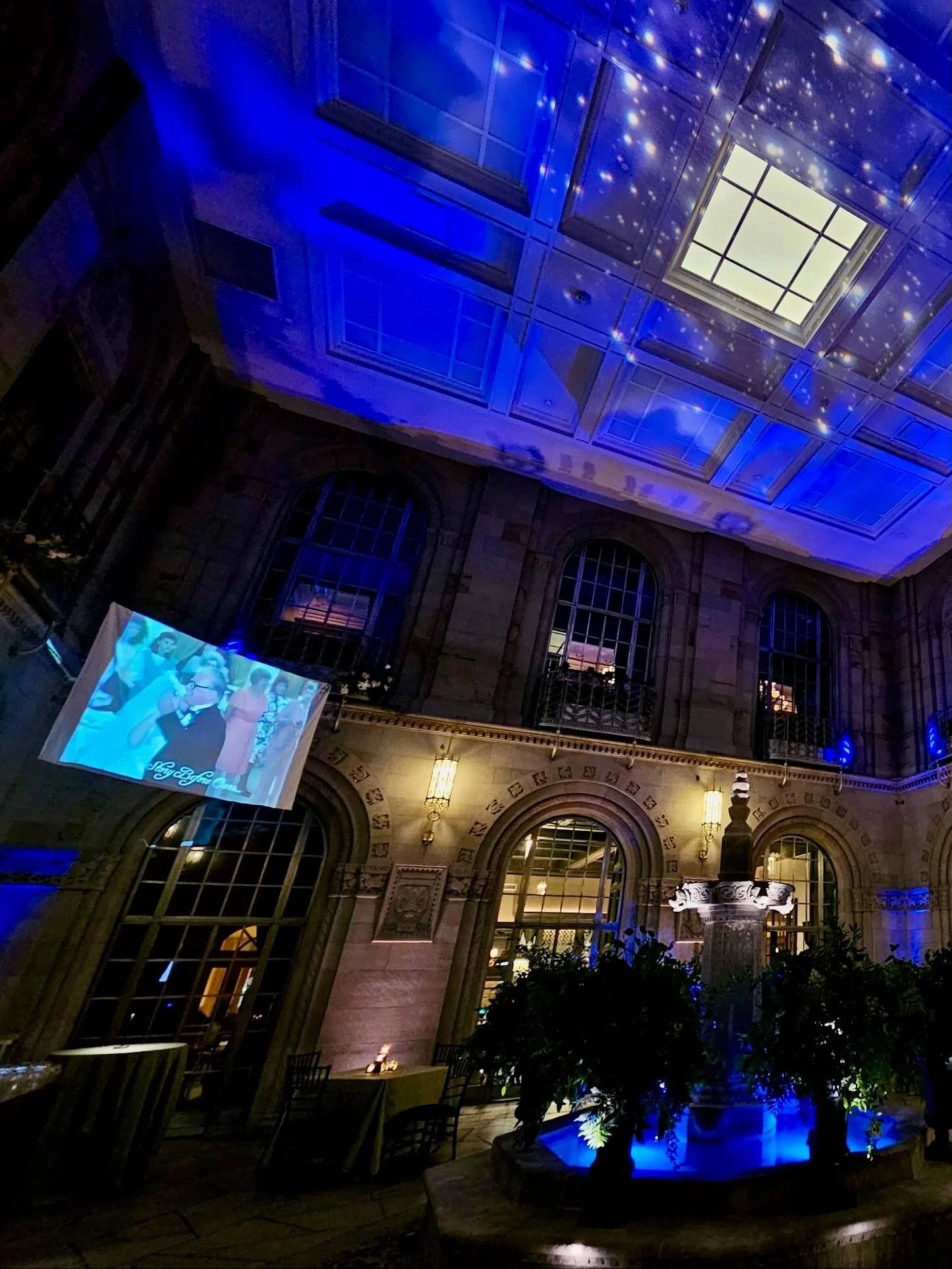 Warm uplighting illuminating the Duquesne Club event space in Pittsburgh