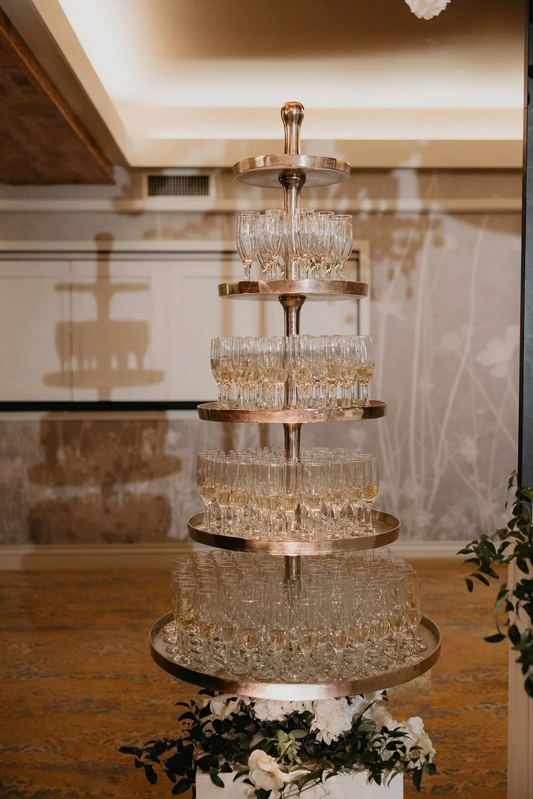 Uplighting on a champagne tower at a wedding reception in Pittsburgh