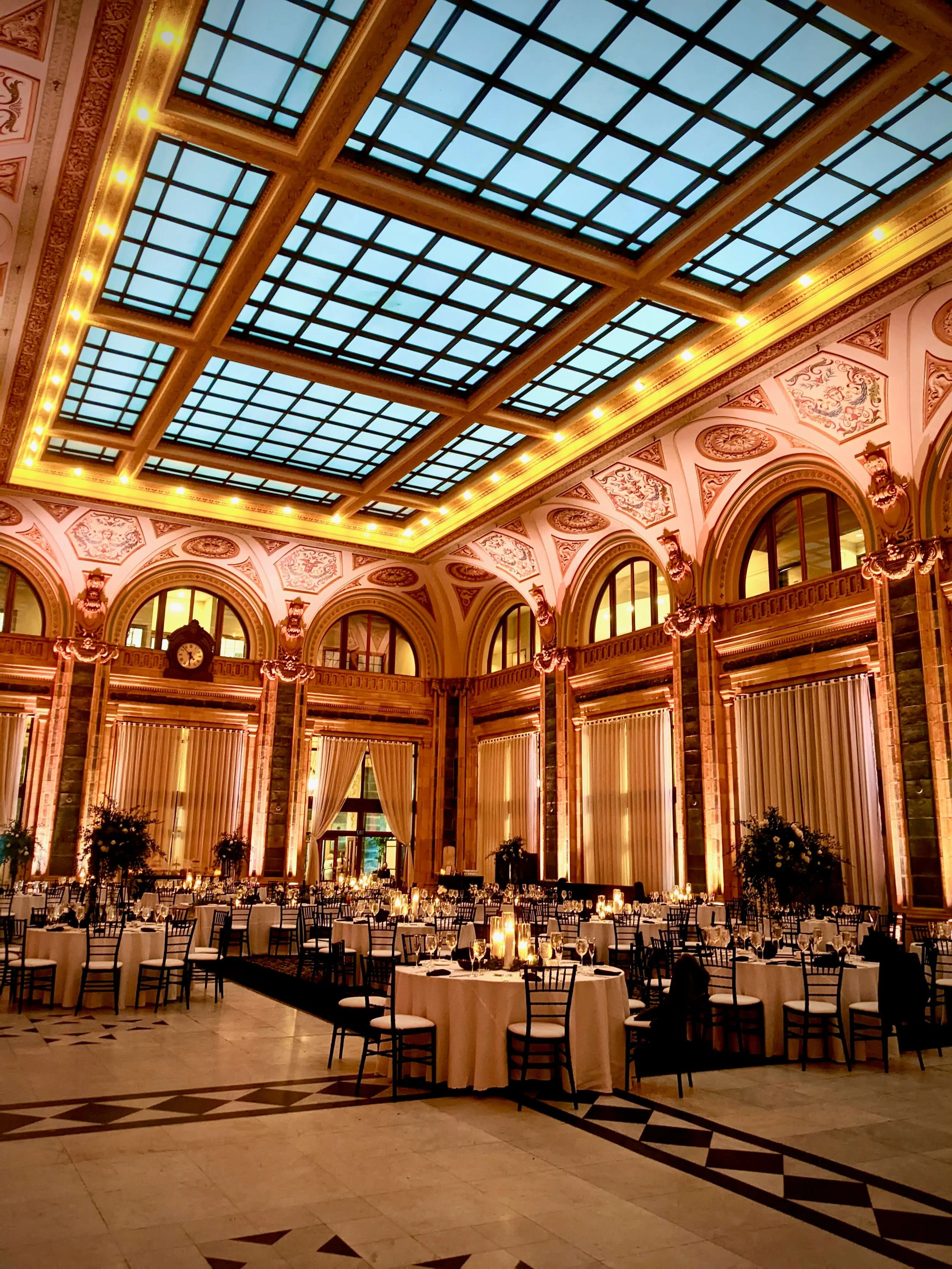 Elegant Pittsburgh wedding reception with warm candlelight-style uplighting at the Pennsylvanian
