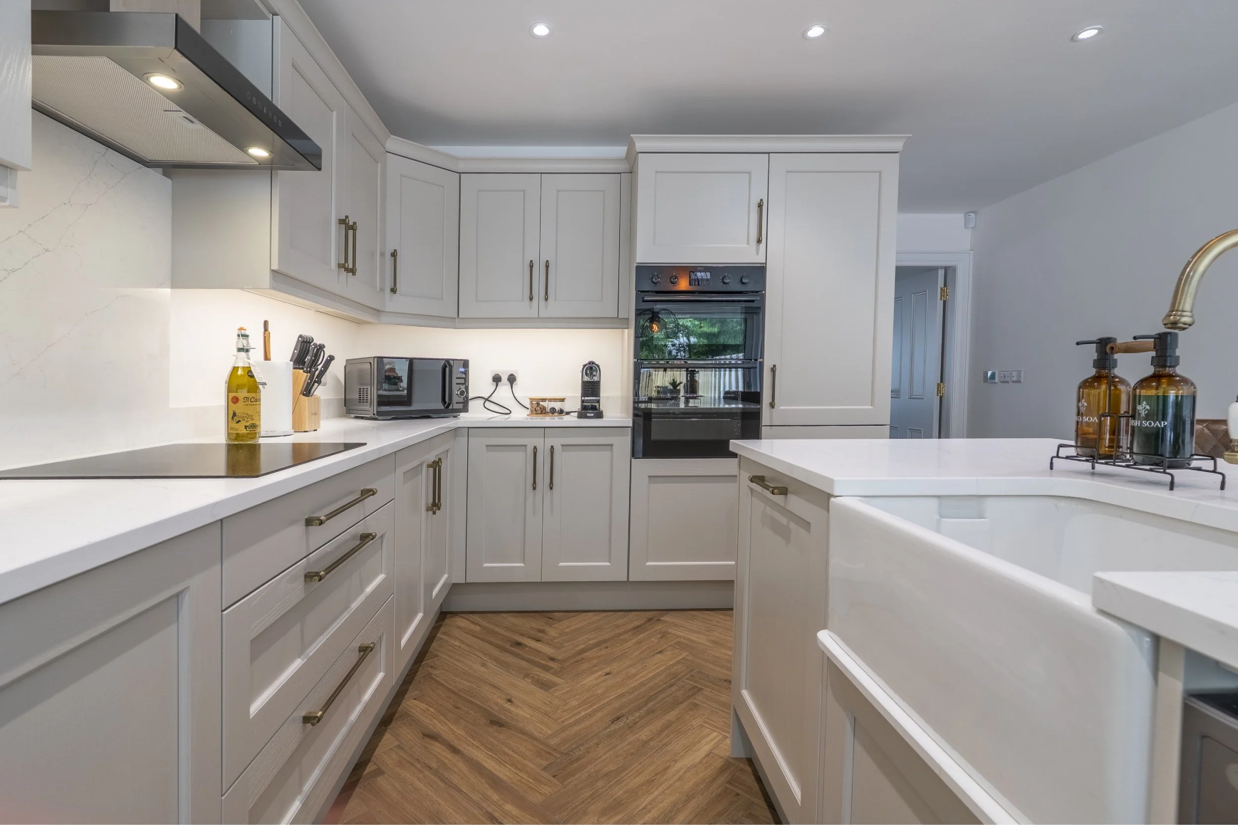 kitchen at The House – Bushmills, modern and fully equiped with all  appliances  including a microwave, a double oven, induction hob, washing machine & tumble dryer. 