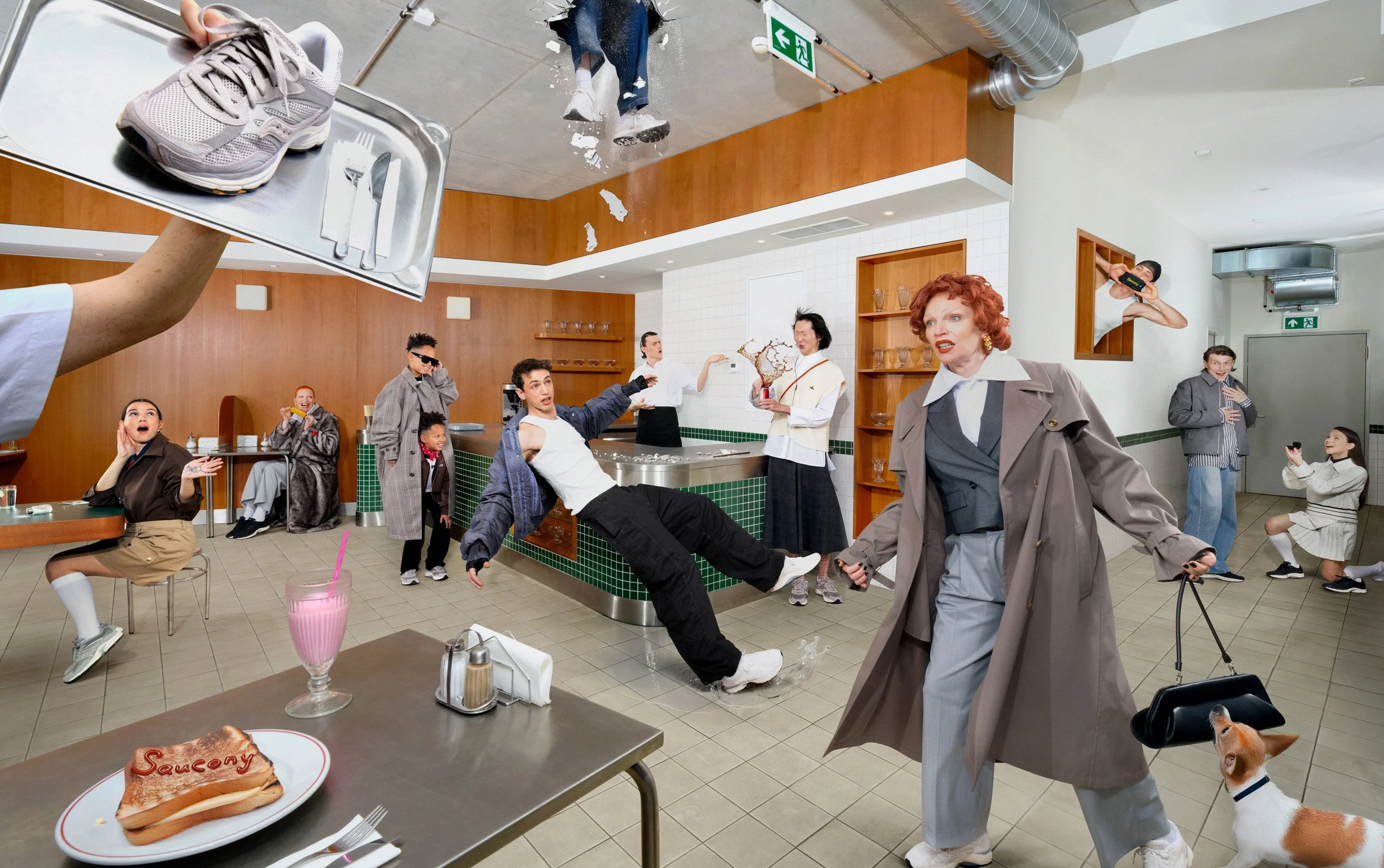 Surreal group scene in a diner-style setting with people in dynamic poses, falling objects, and a dog, referencing Saucony sneakers.