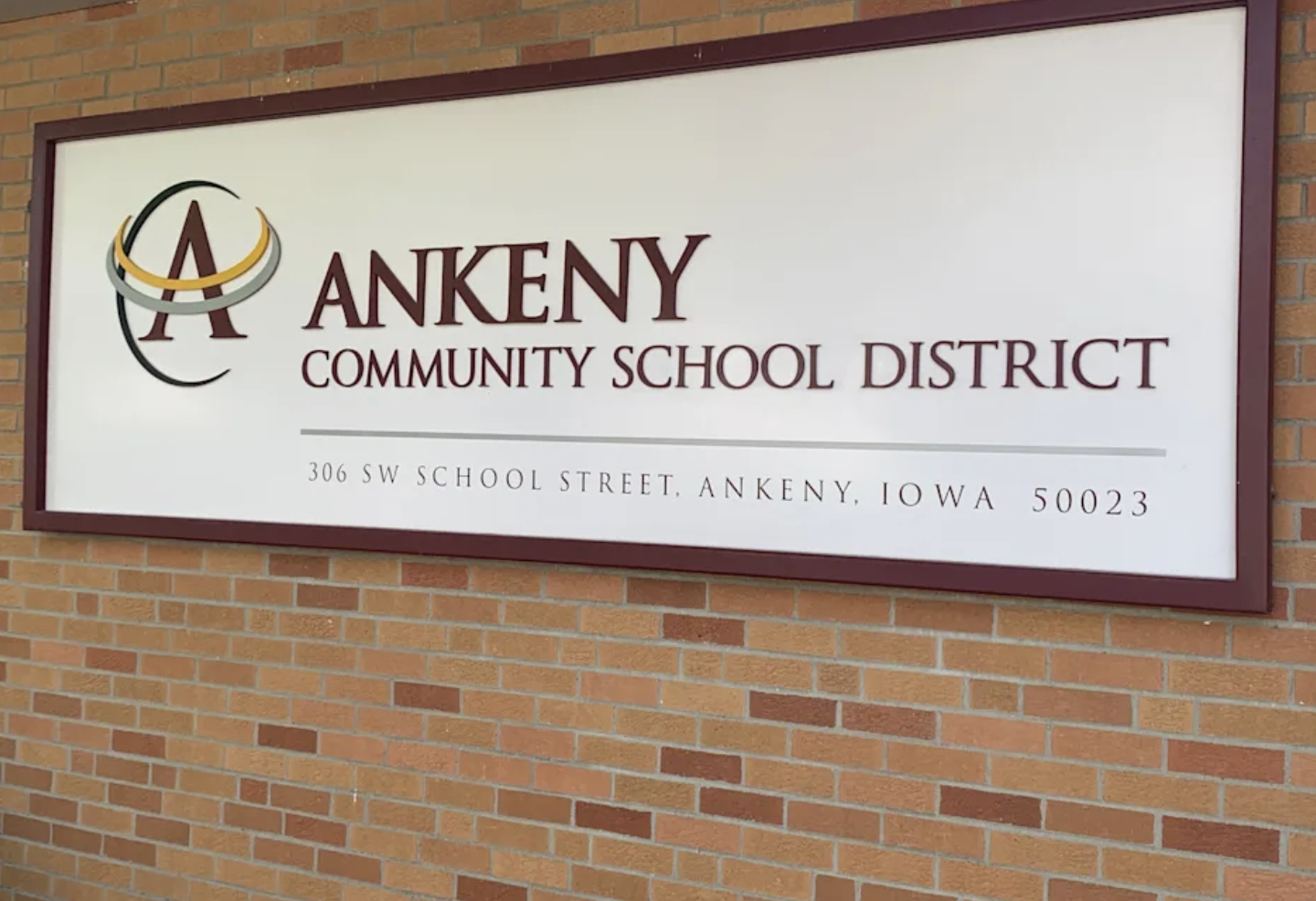 Sign for Ankeny Community School District with district logo and address