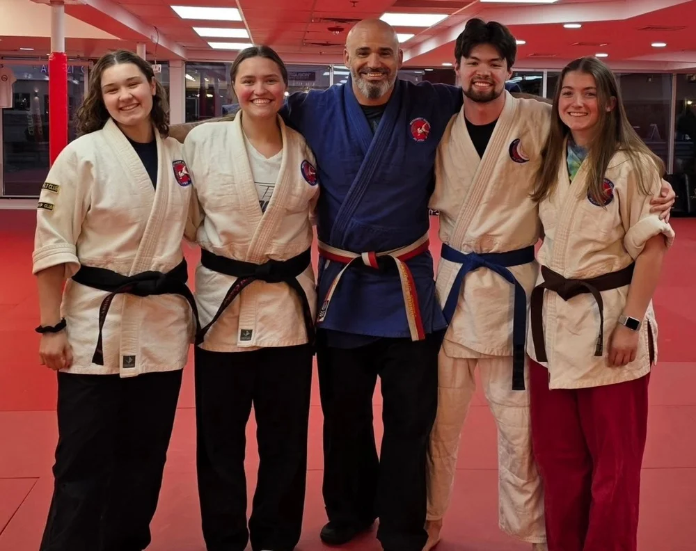 Sensei Paul DiRienzo with four of the academy's senior black and brown belts