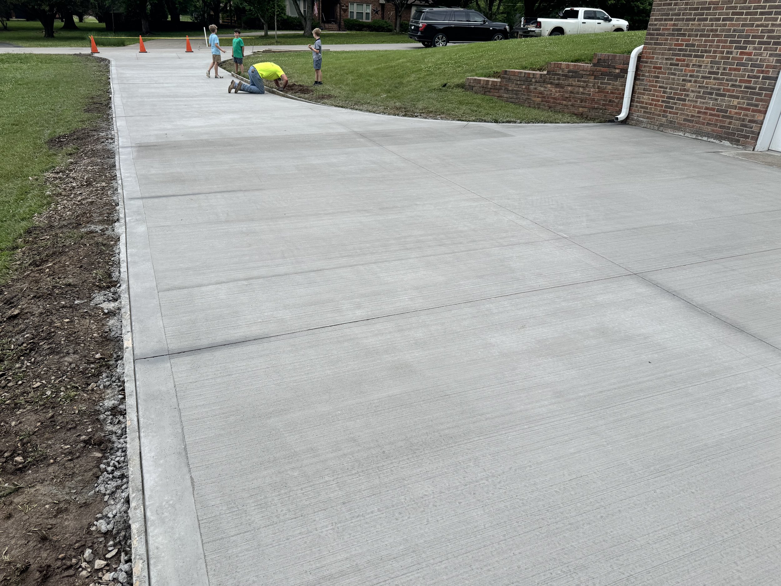 We removed the exposed aggregate peagravel driveway and poured this beautiful broom finish drive. 