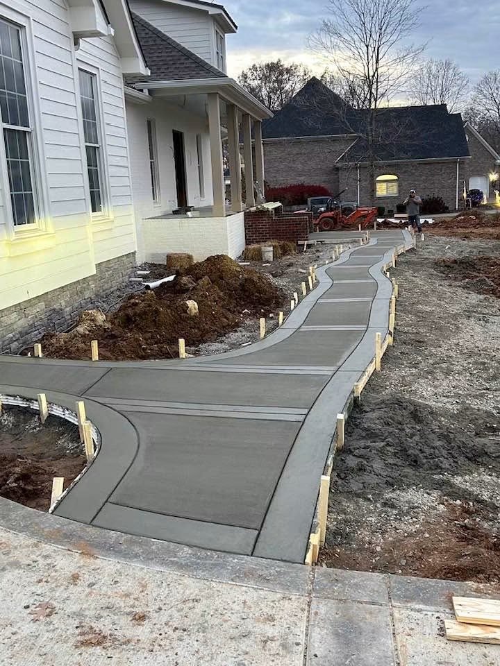 Even without stamps and staining, you can still have a beautiful sidewalk with a elevated look! Completed by one of our trusted trade partners.