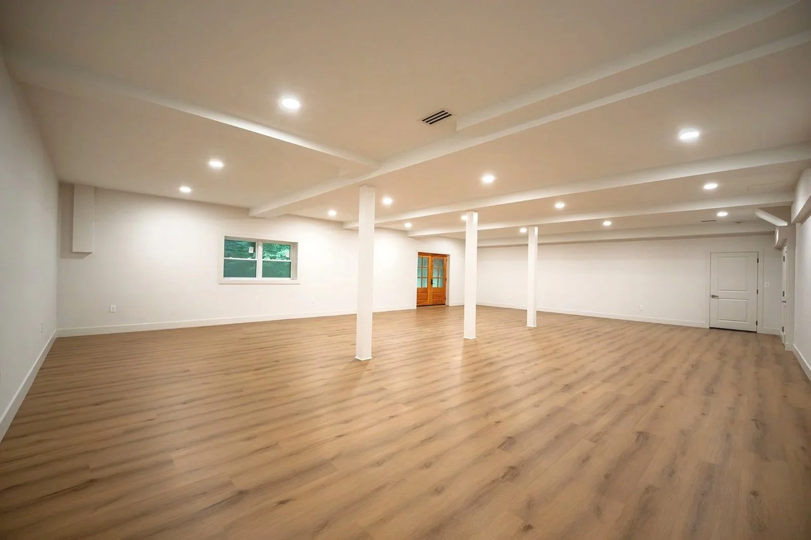 Spacious finished lower level offering flexible space for recreation, entertaining, fitness or a home office.