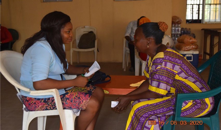 Workshop Assistant administering a pre-workshop questionnaire.