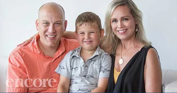 Image of a family, husband wife and son. Links to a story from Encore Magazine.