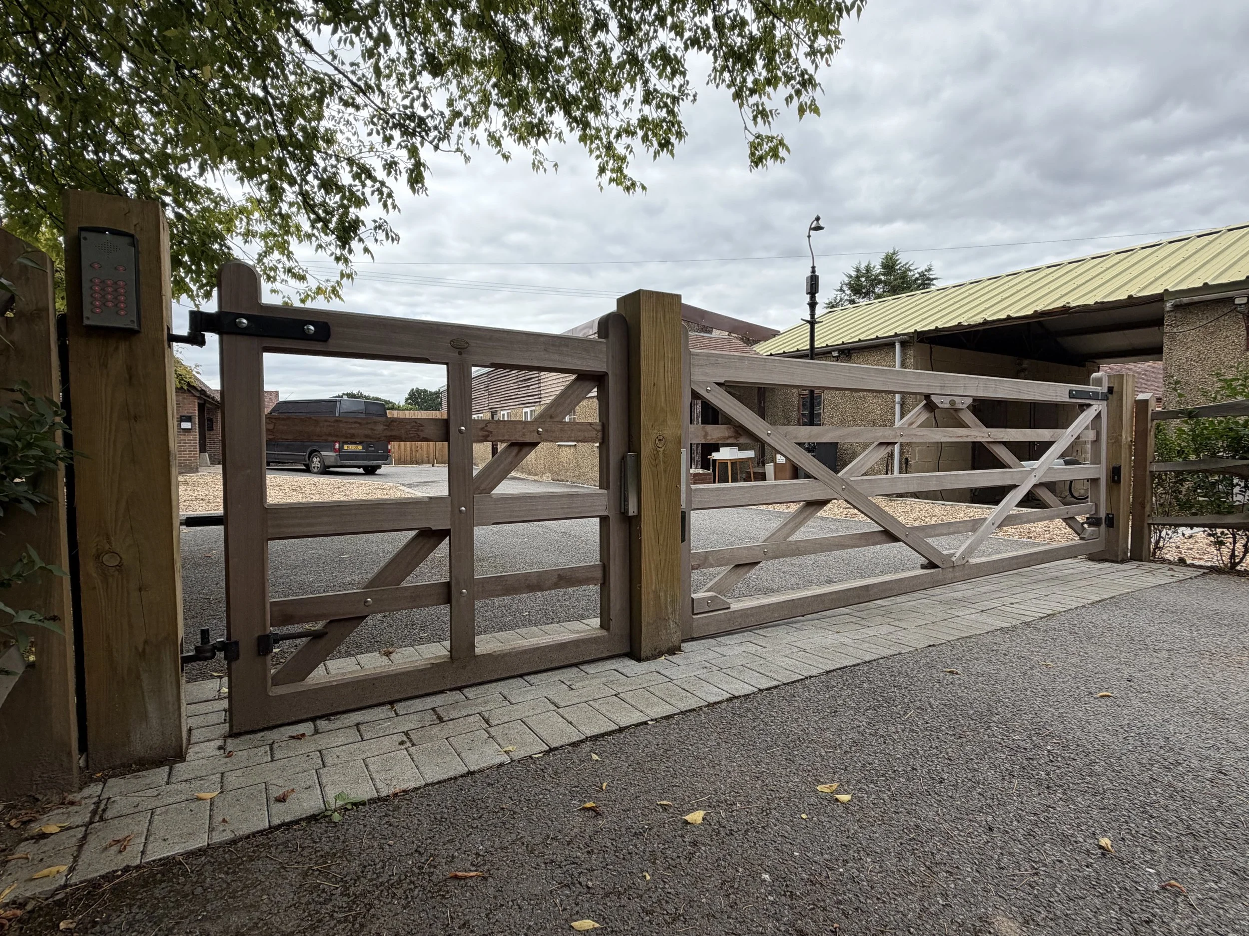 Timber swing gates at a driveway entrance