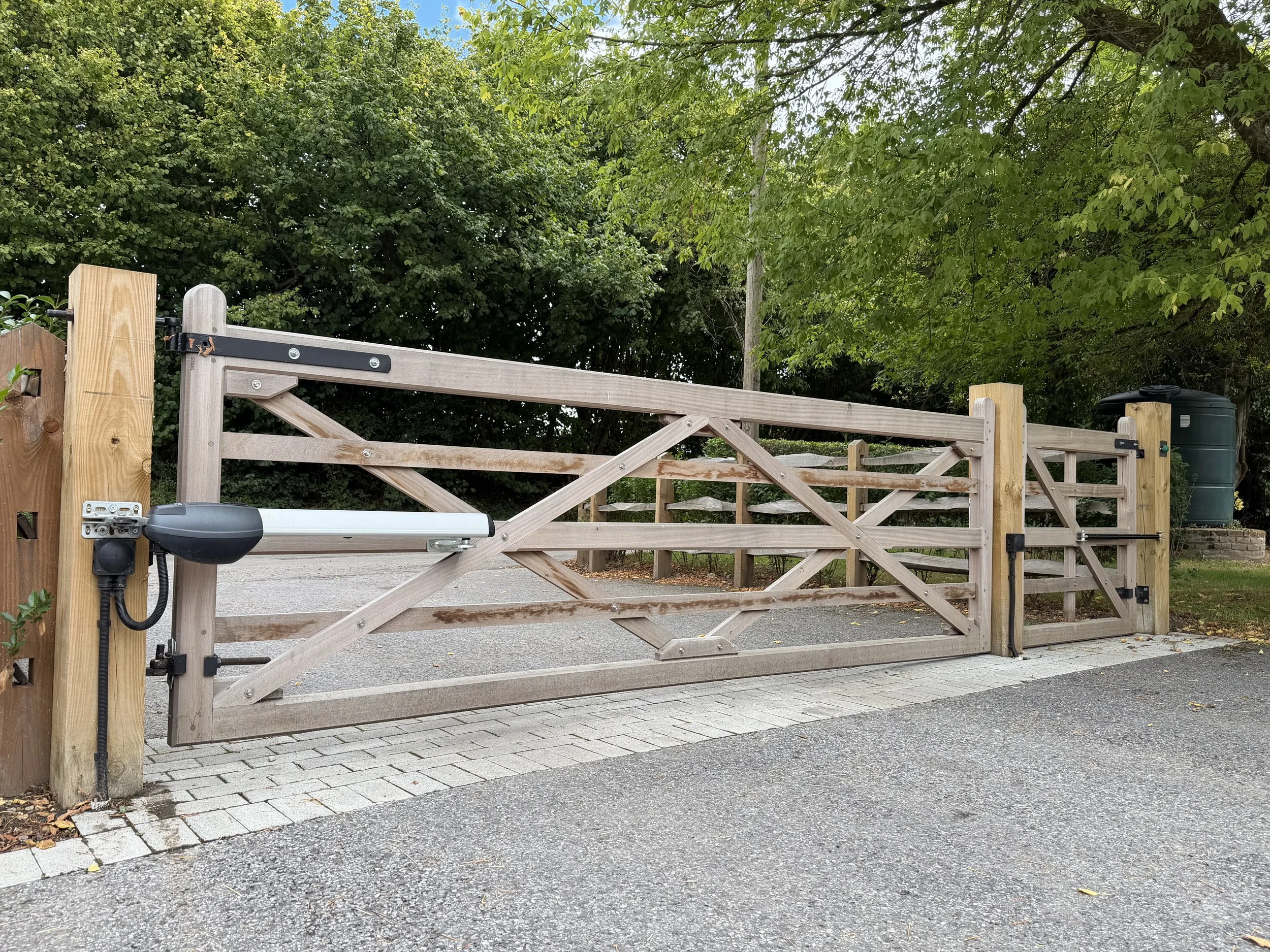 Timber double gates fitted with an electric swing gate motor