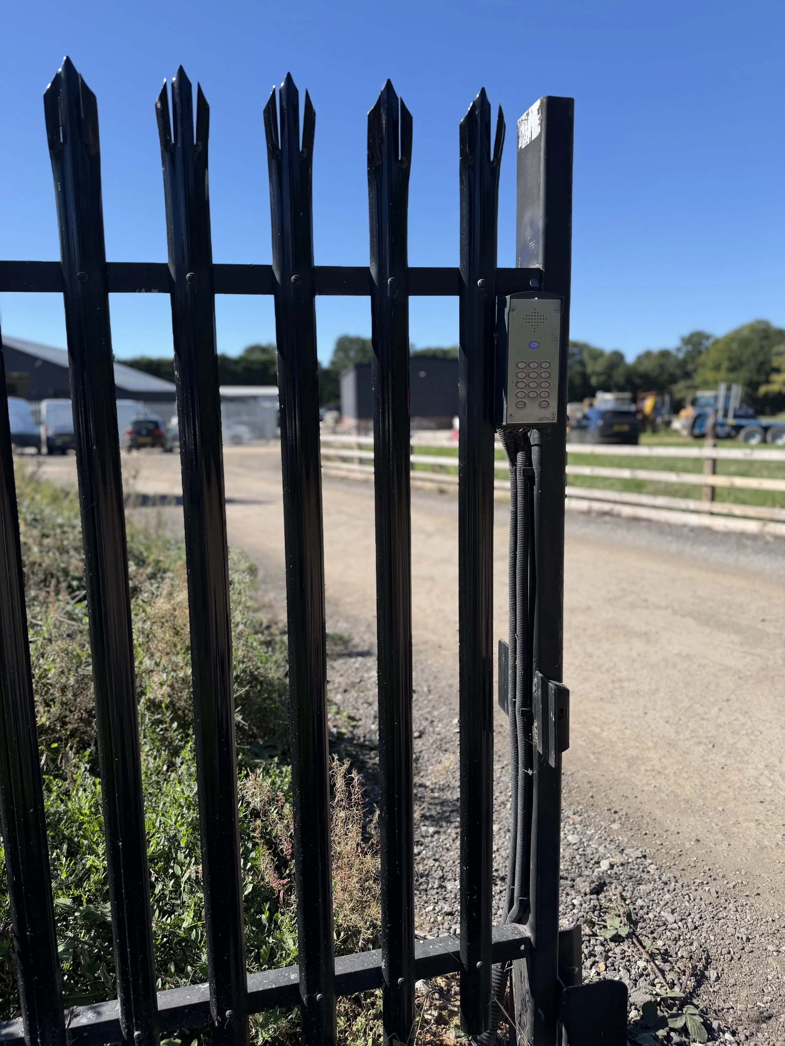 Black steel vertical-bar gate with spear tops