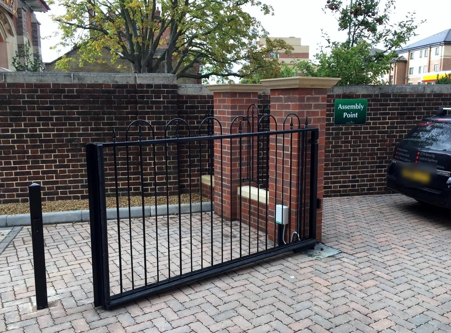Automated single swing gate across a car park entrance