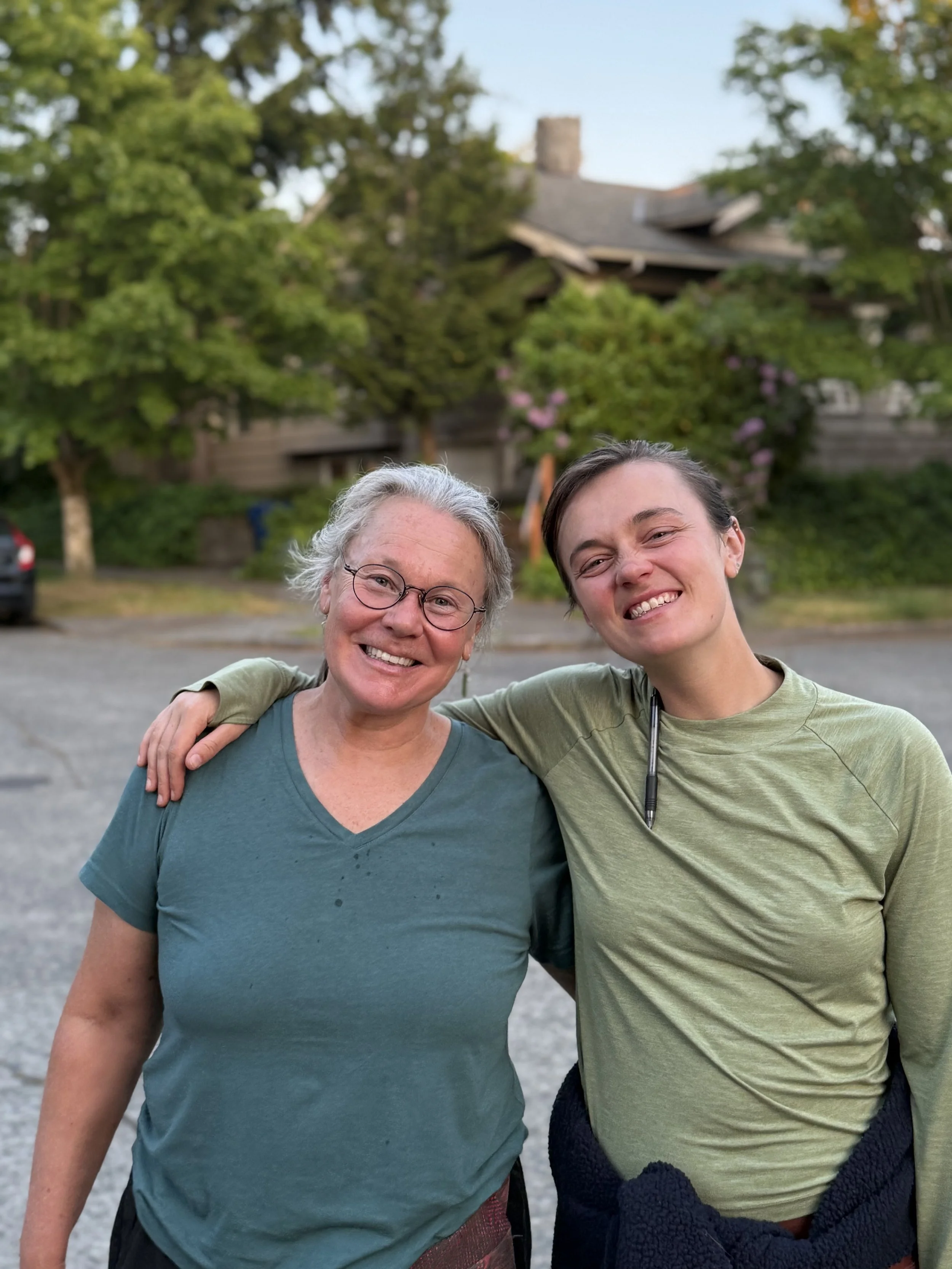 Mother and daughter at a neighborhood intersection, celebrating their first market.