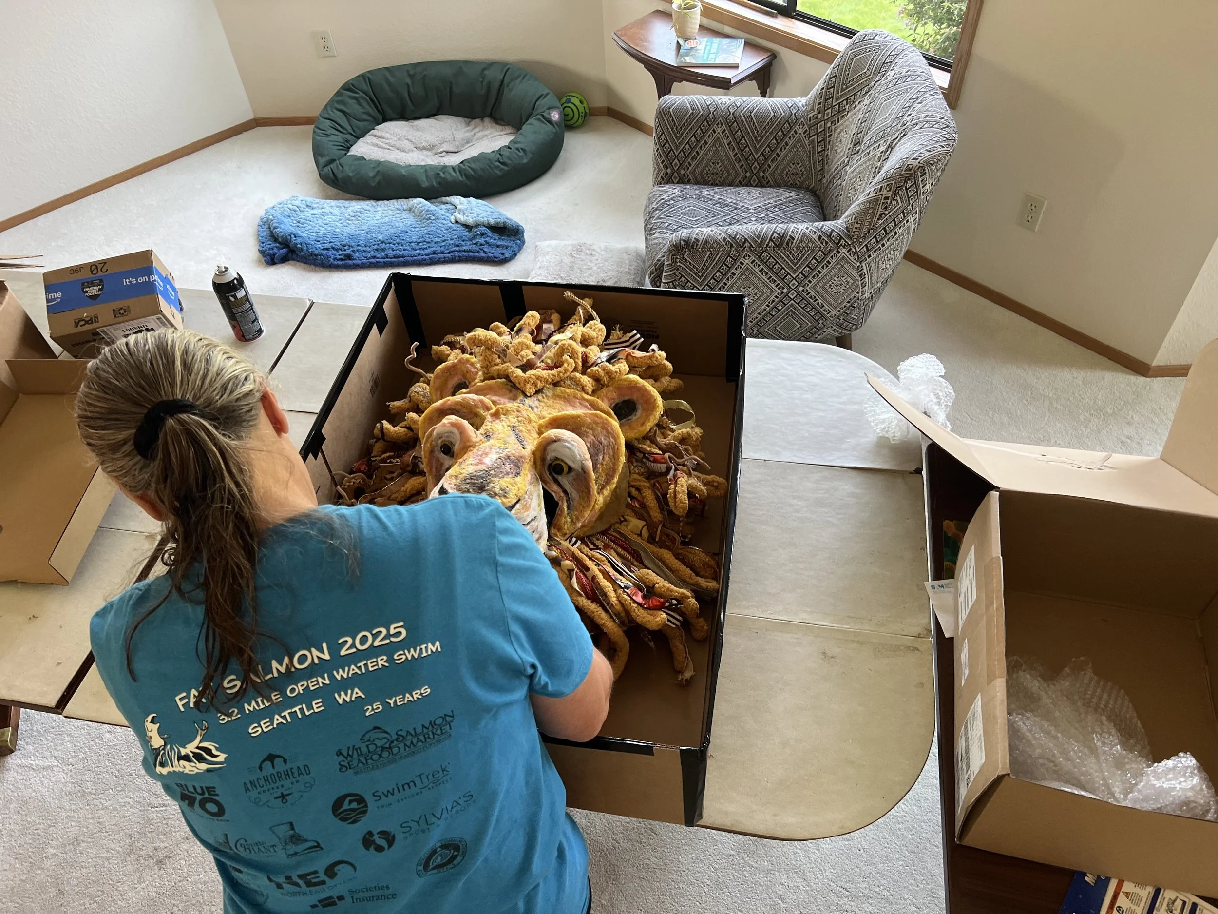 Carefully packing up the lion puppet