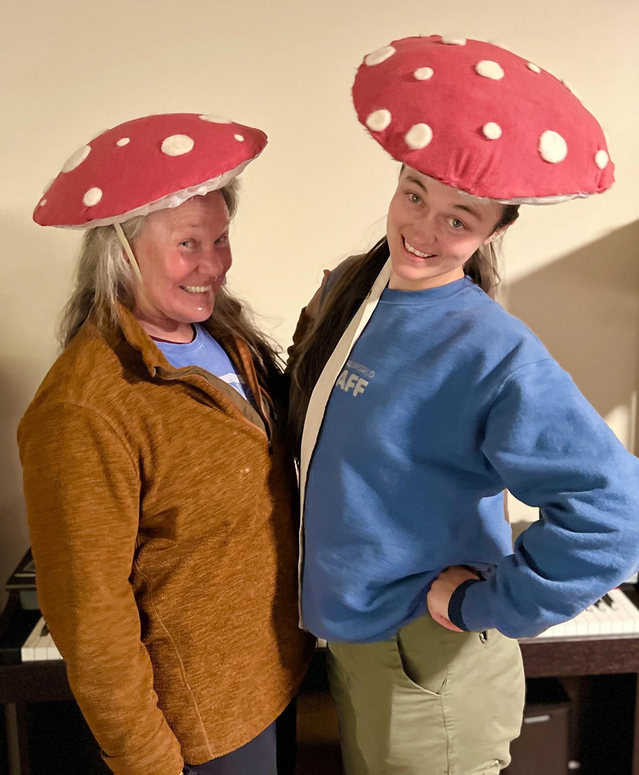 laughing while we model our mushroom hats
