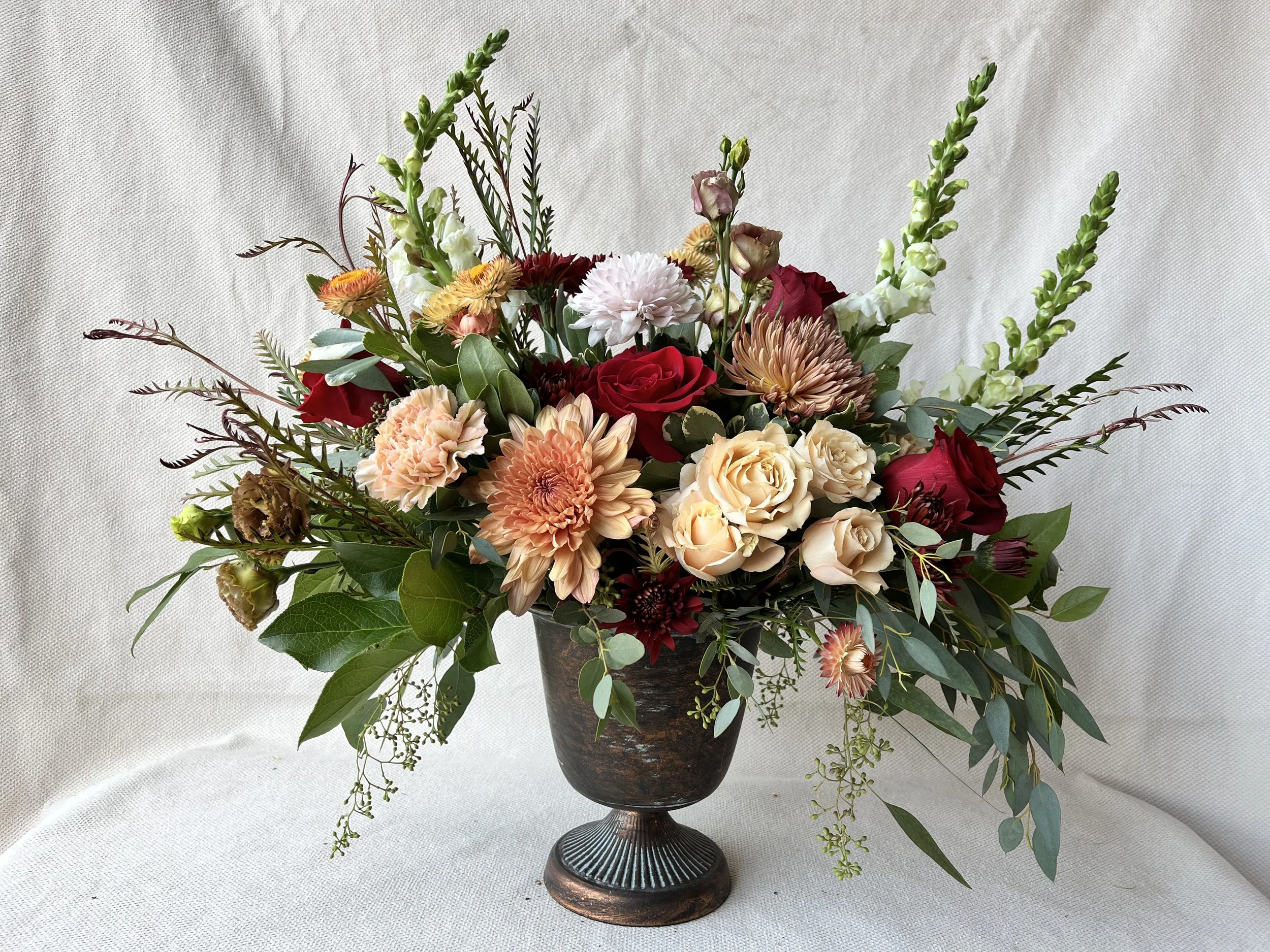 Winter bridal wedding centerpiece peach red