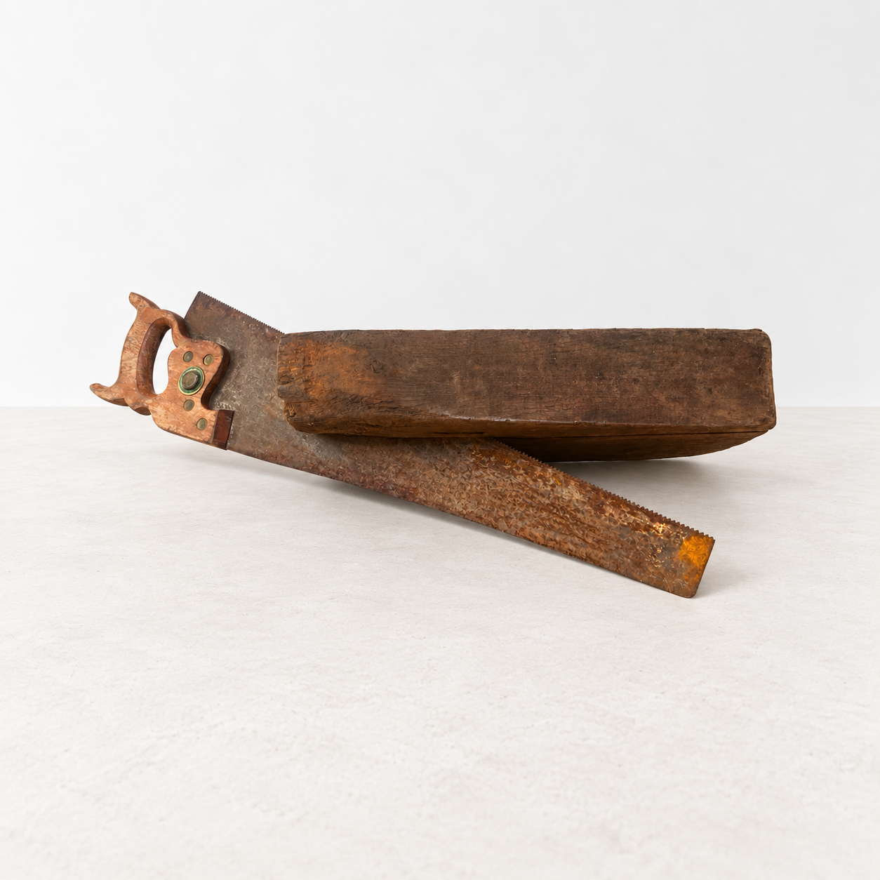 Rustic wood sculpture with rusty saw-2.png