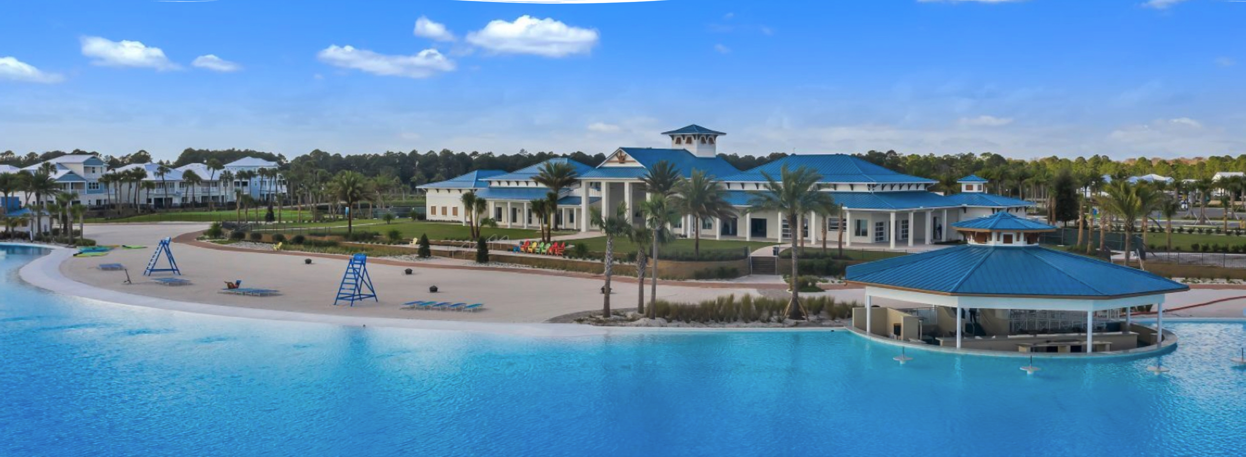 Beachwalk Clubhouse on Crystal Lagoon with beach, dining and swim-up bar