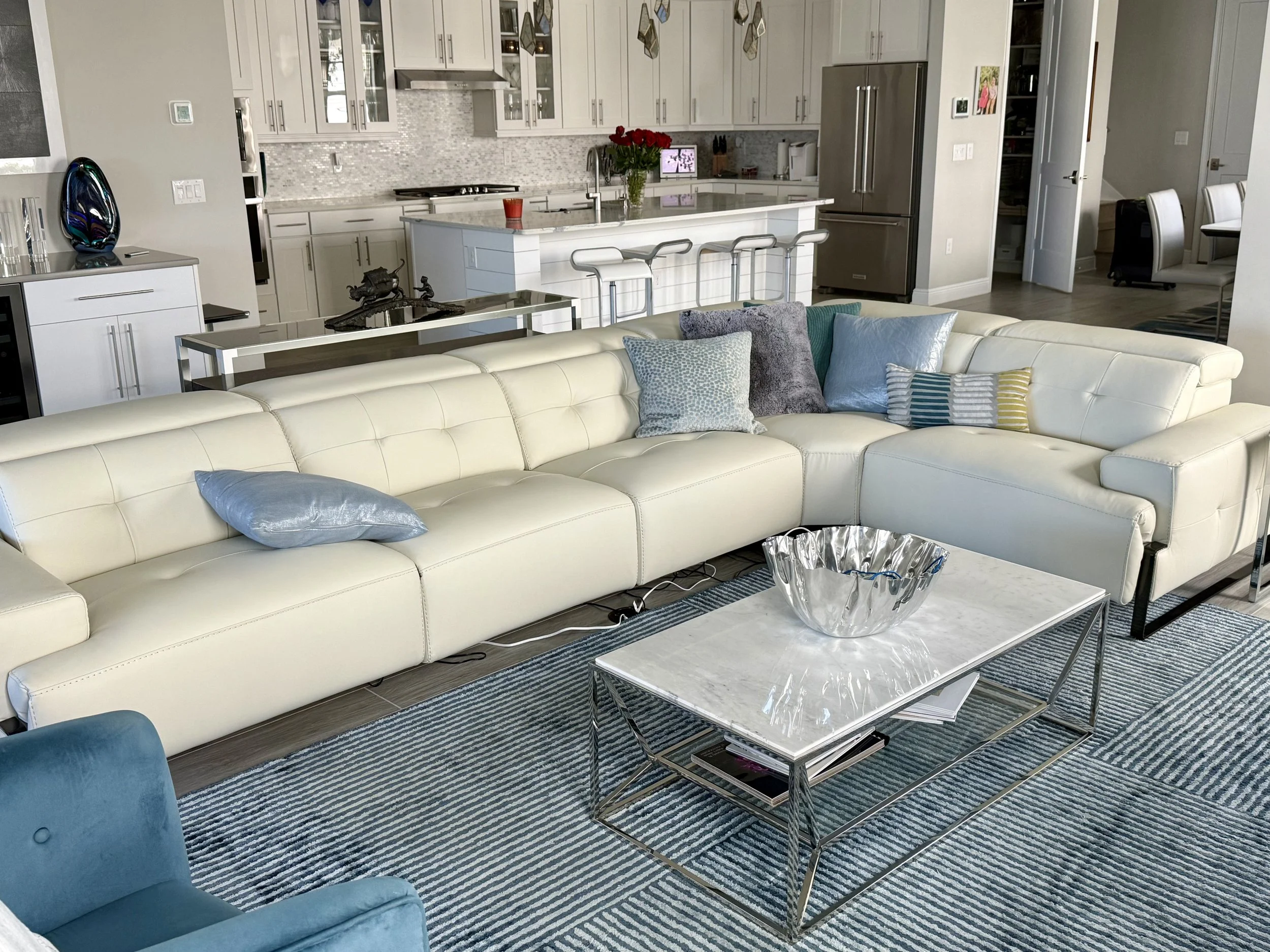 Open great room and kitchen at 155 Rum Runner Way with large sectional seating and island