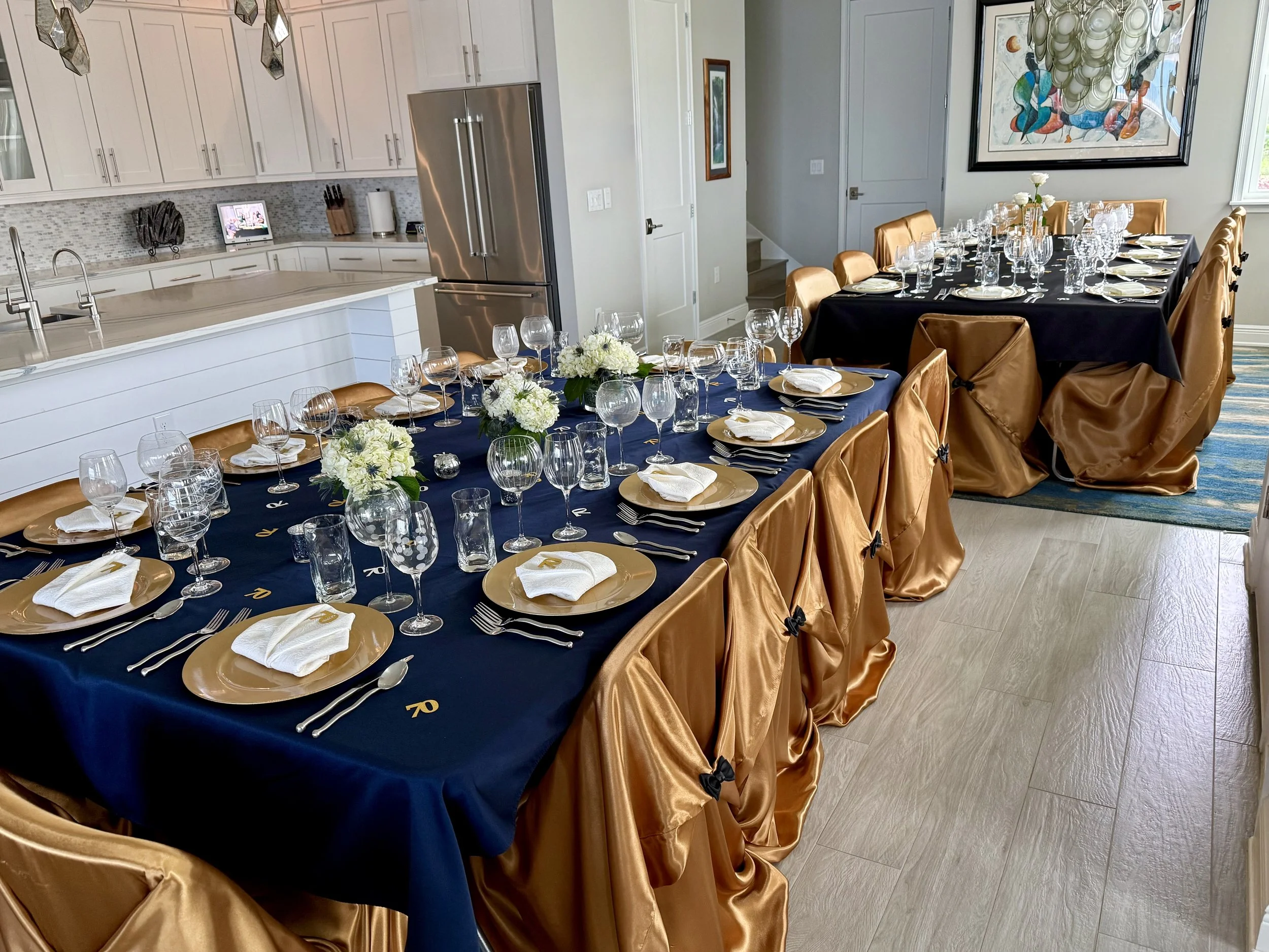 Dining area at 155 Rum Runner Way arranged with two tables for large gatherings and entertaining