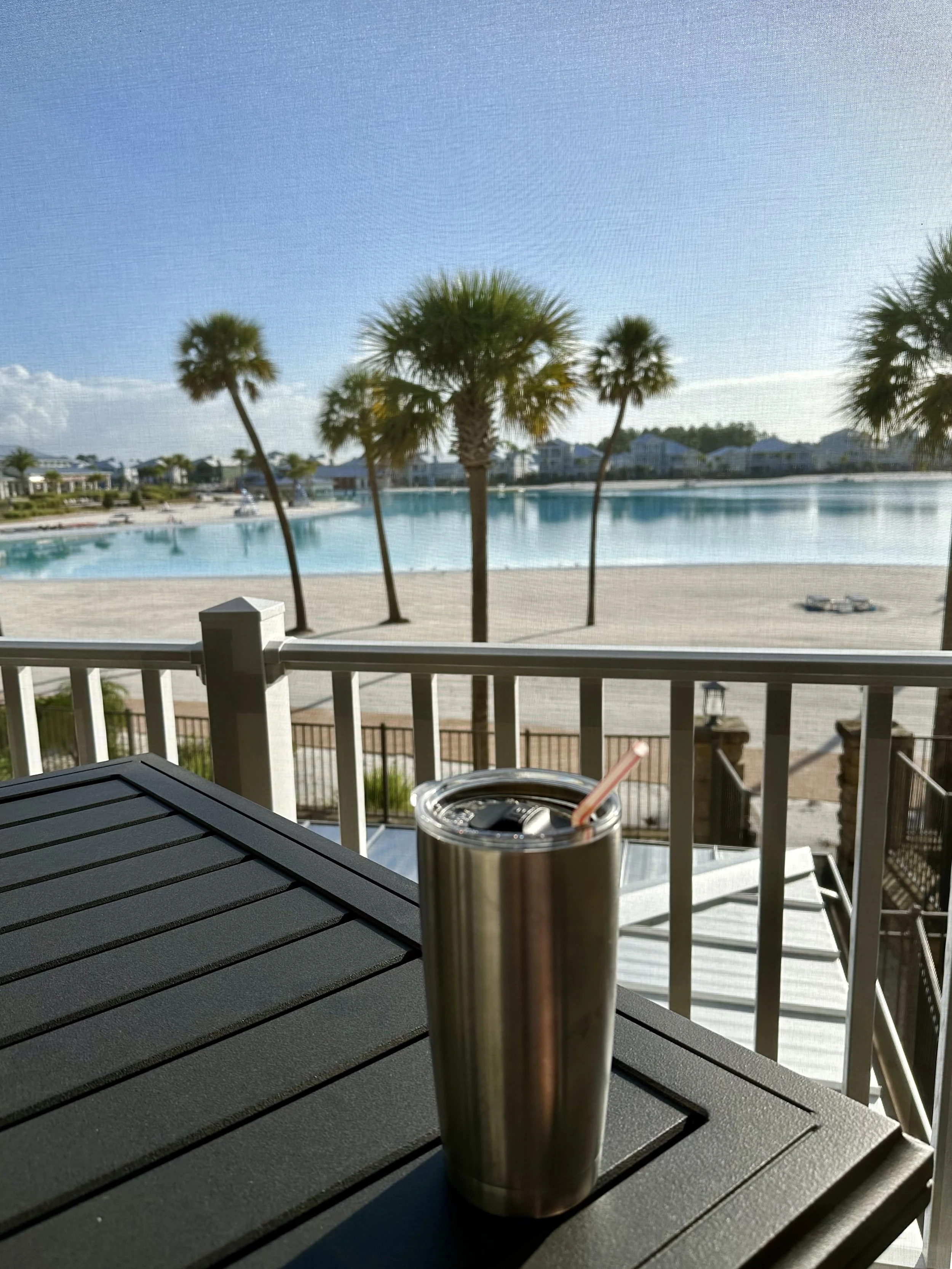 Second-floor lanai overlooking Beachwalk Crystal Lagoon and beach