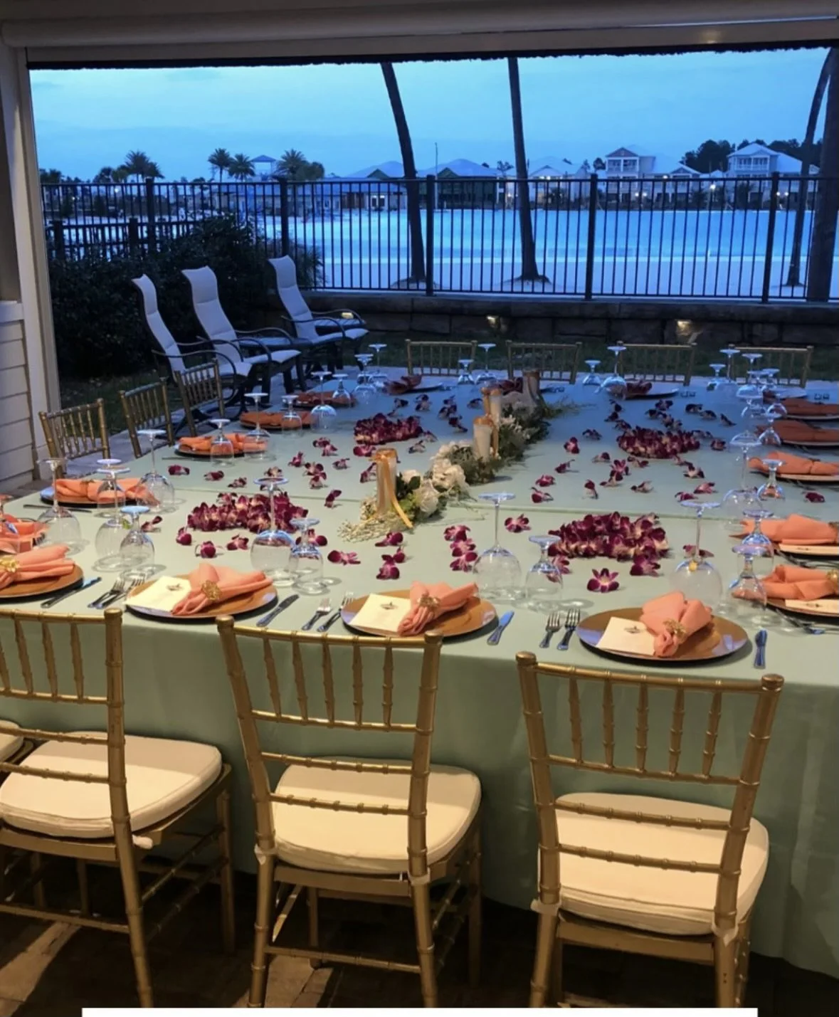 Expanded lagoon-front lanai set for a large dinner gathering at 155 Rum Runner Way