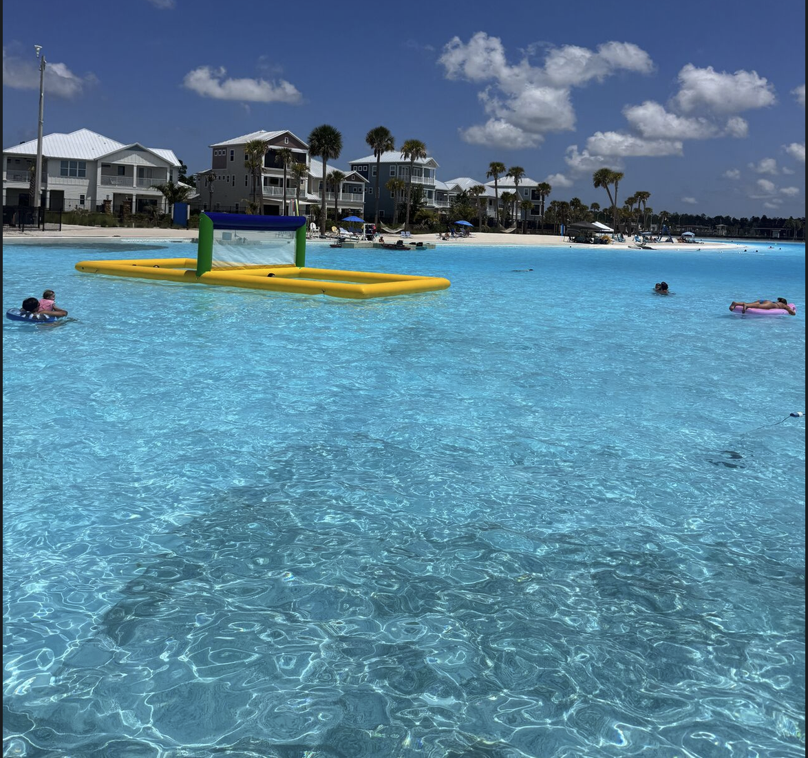 Swimmers enjoying the clear water of Beachwalk Crystal Lagoon