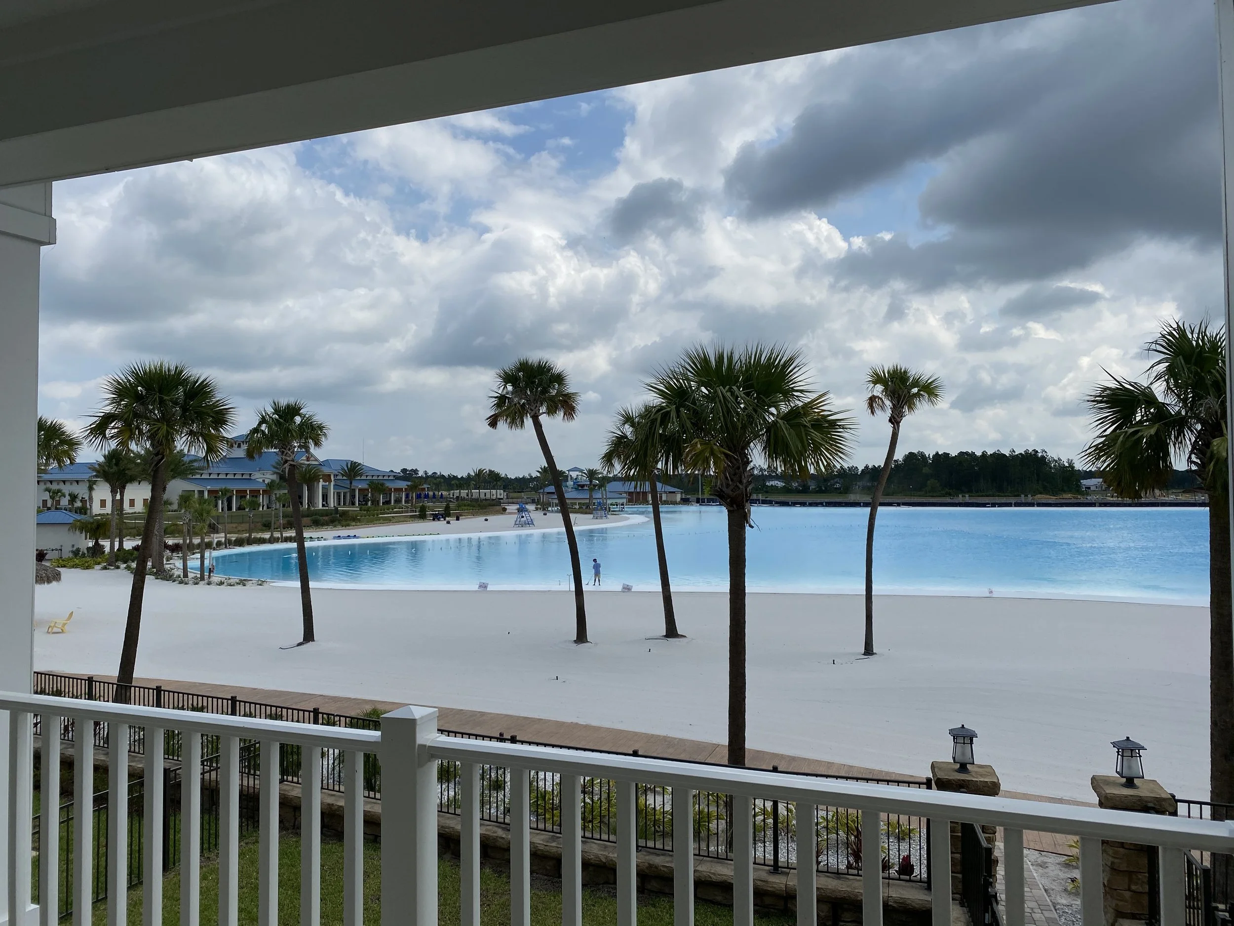 Beachwalk Crystal Lagoon and sandy beach viewed from the second-floor lanai at 155 Rum Runner Way