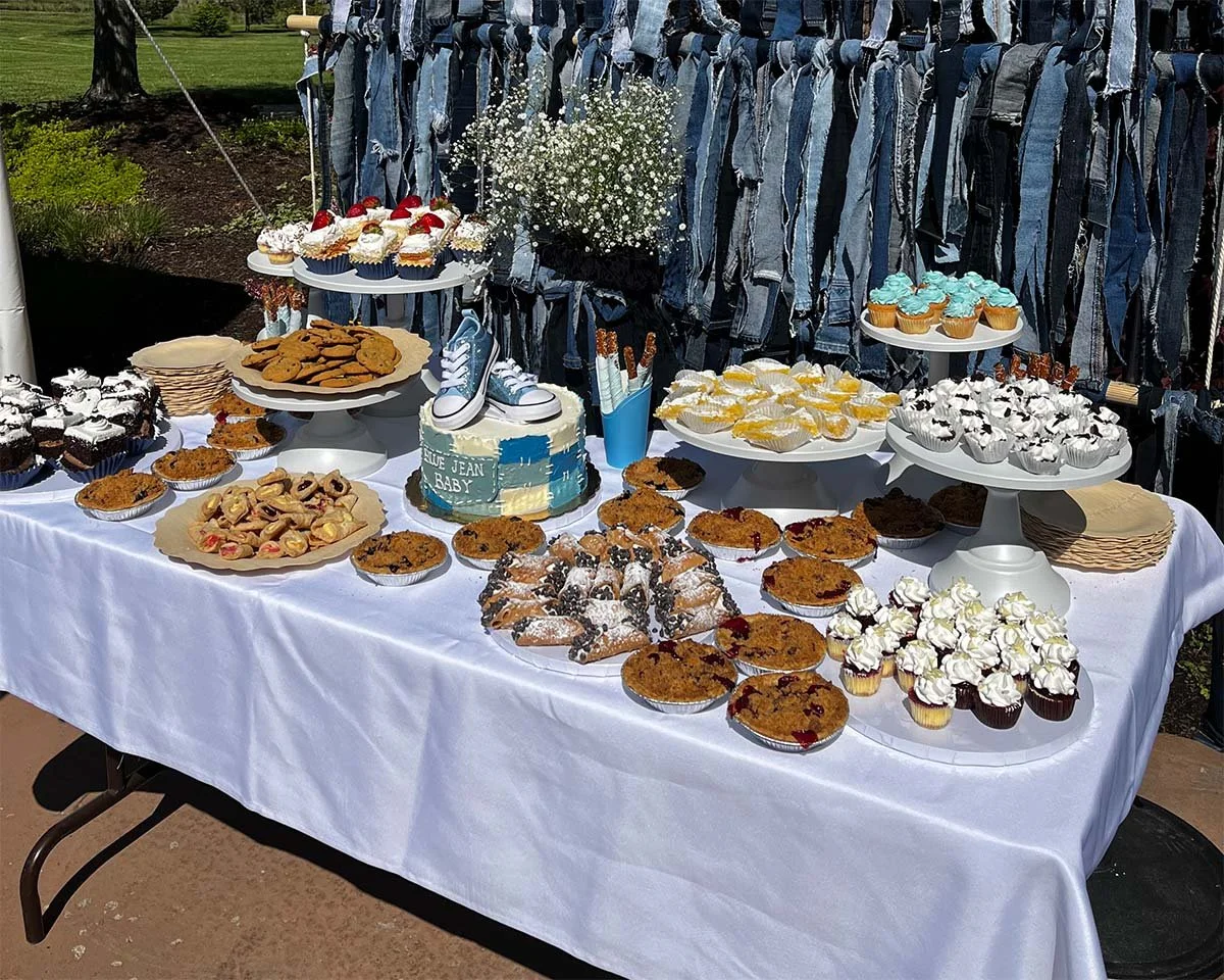 Catering tables with assorted pastries and pies