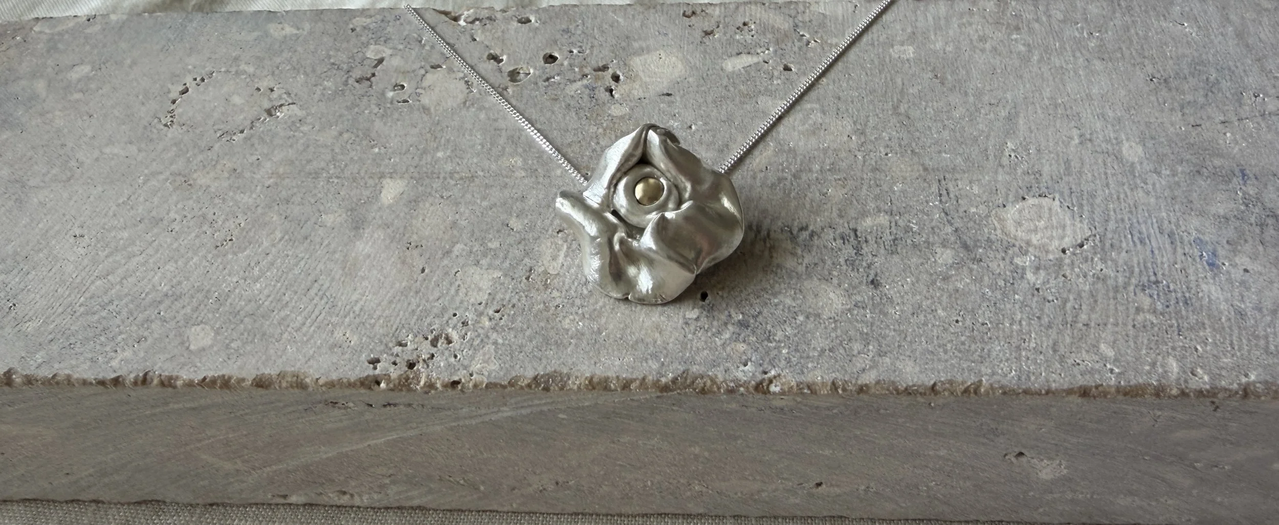 Organic fine silver pendant with flowing sculptural form by Avila Jewellery Designs