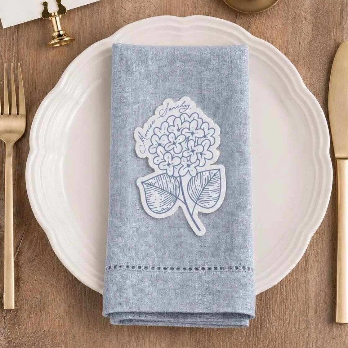 A little touch of personalized charm for the table. 🤍

Our hand-cut floral place cards are designed to make every setting feel extra special &mdash; featuring delicate florals, elegant handwritten names, and a timeless blue-and-white palette.

Shop 
