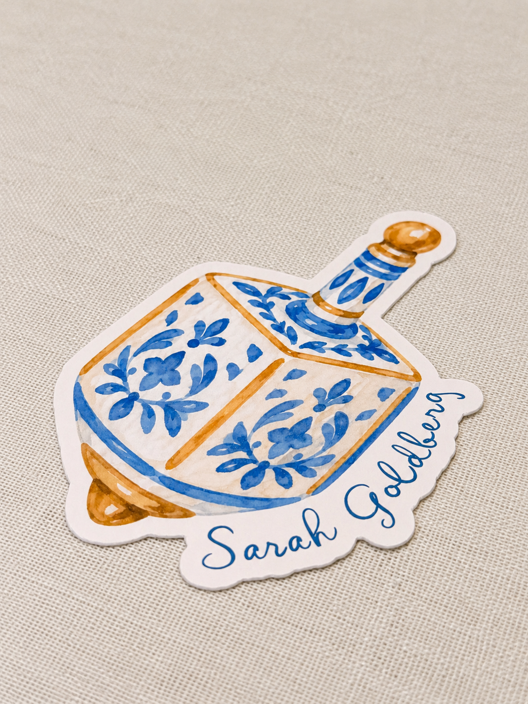 Watercolour Dreidel Place Card on Linen.png