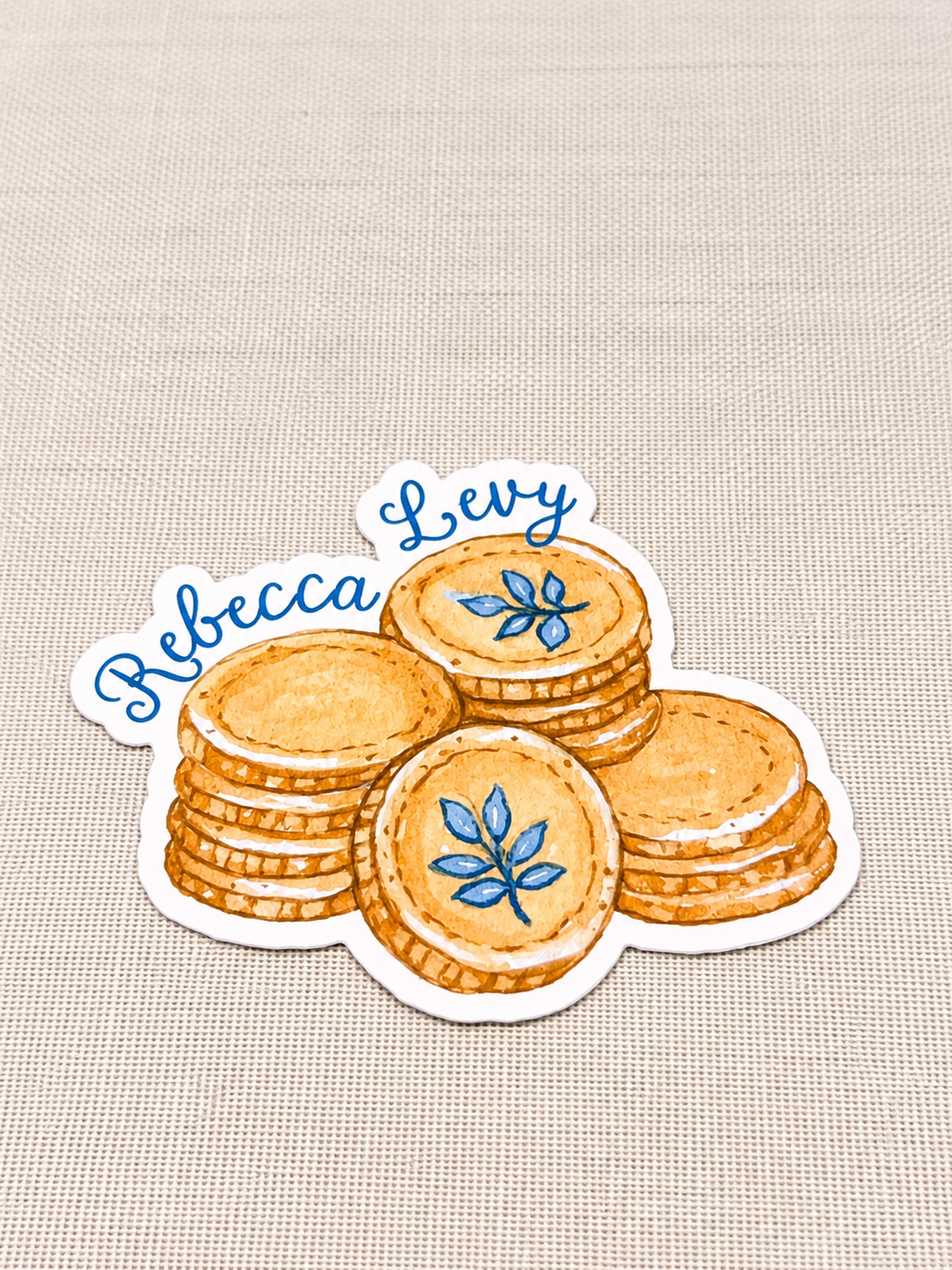 Rebecca Levy Cookie Sticker on Linen.png