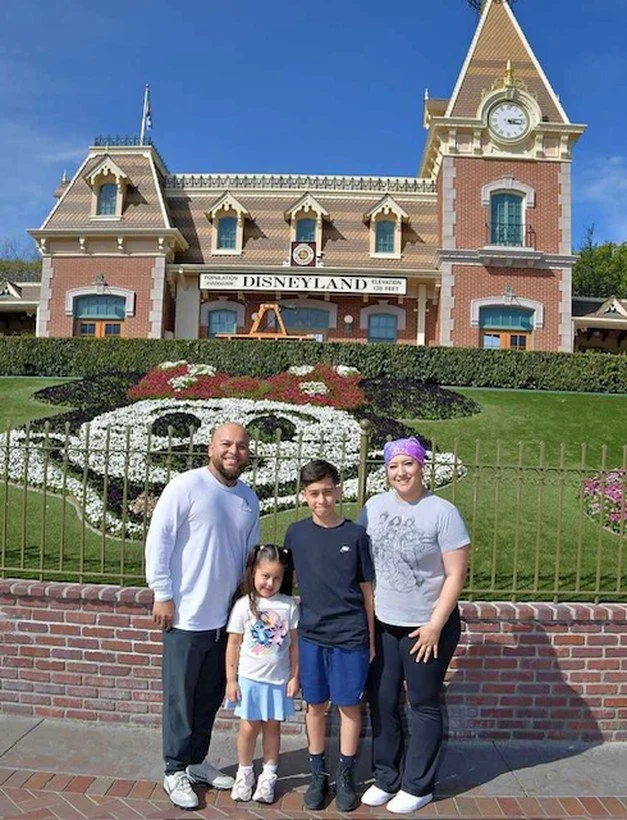 A family helped by Mother's Grace, together at Disneyland