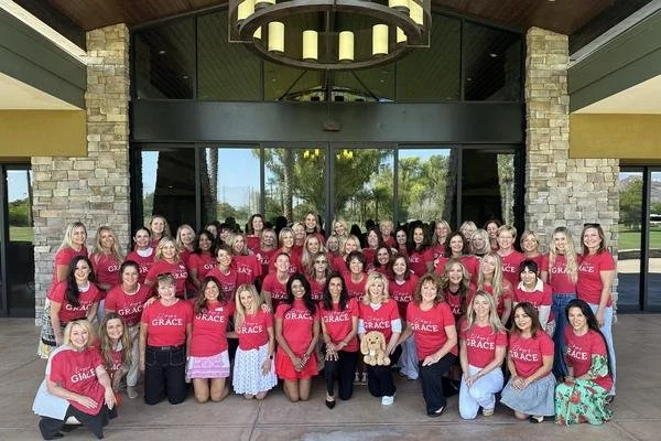 The Mother's Grace team in matching shirts at a community event