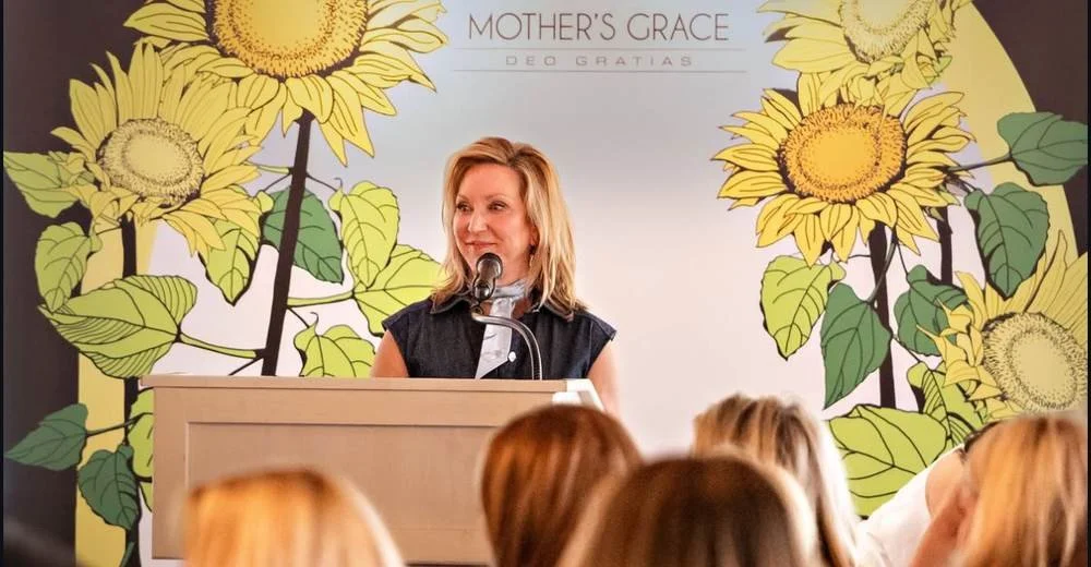 Michelle Moore speaking at a Mother's Grace event