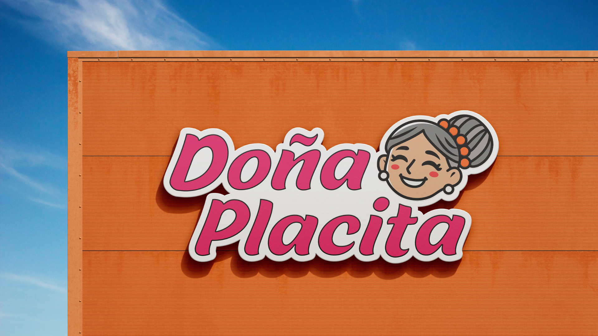 Carpa naranja con cartel que dice "Doña Placita" y una ilustración de una mujer mayor sonriendo, en un cielo azul.