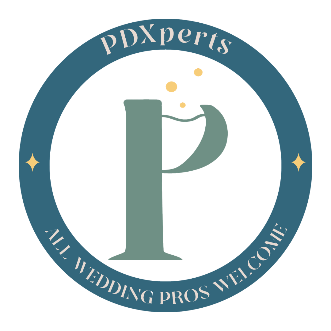 A circular logo with a large letter 'P' in the center. The surrounding text reads 'PDXperts' at the top and 'All Wedding Pros Welcome' at the bottom. The logo features a professional design with a blue circle and some decorative elements.