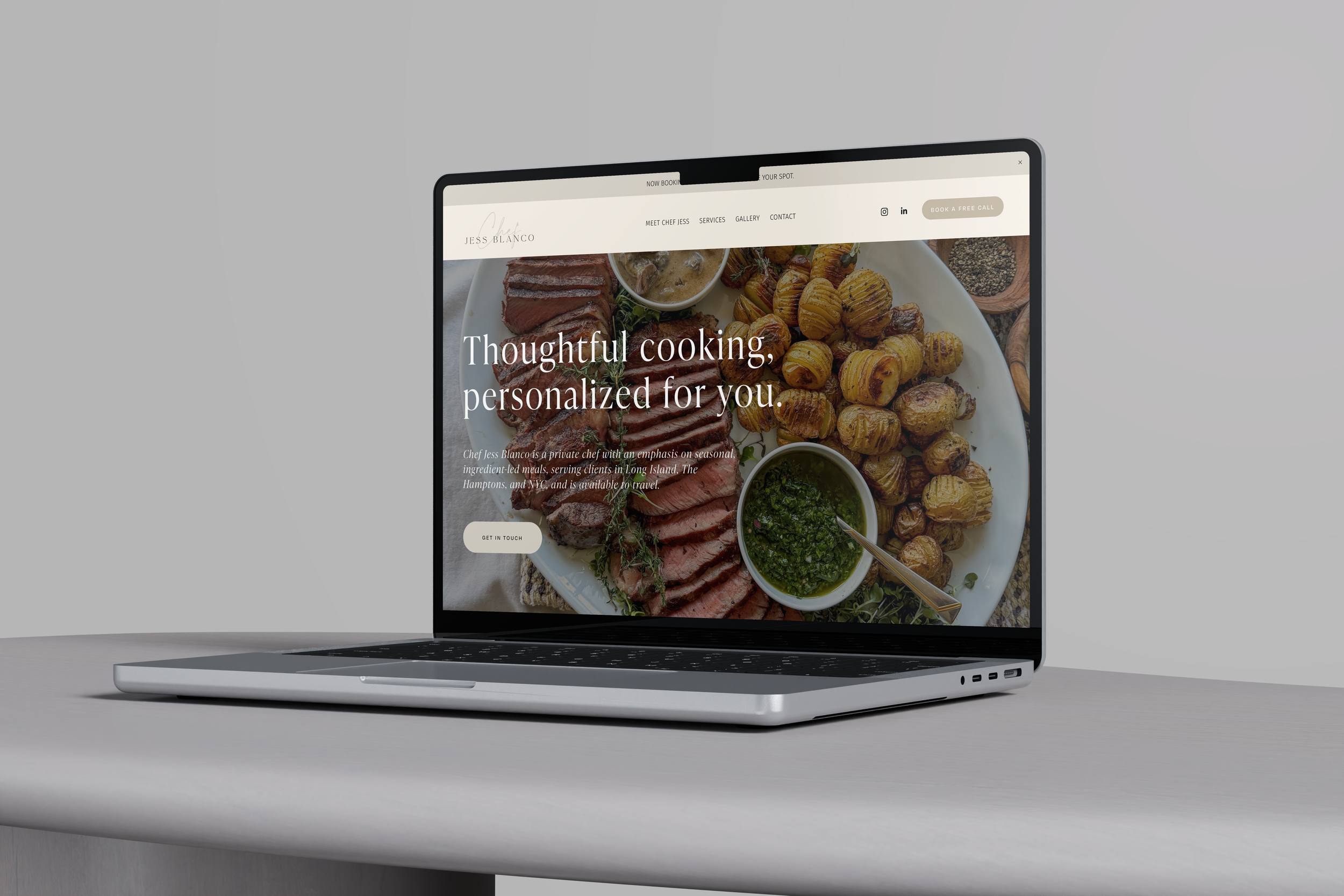 Laptop displaying a website with a picture of a gourmet meal, including sliced meat, roasted potatoes, and green dipping sauce, with text promoting personalized cooking services.