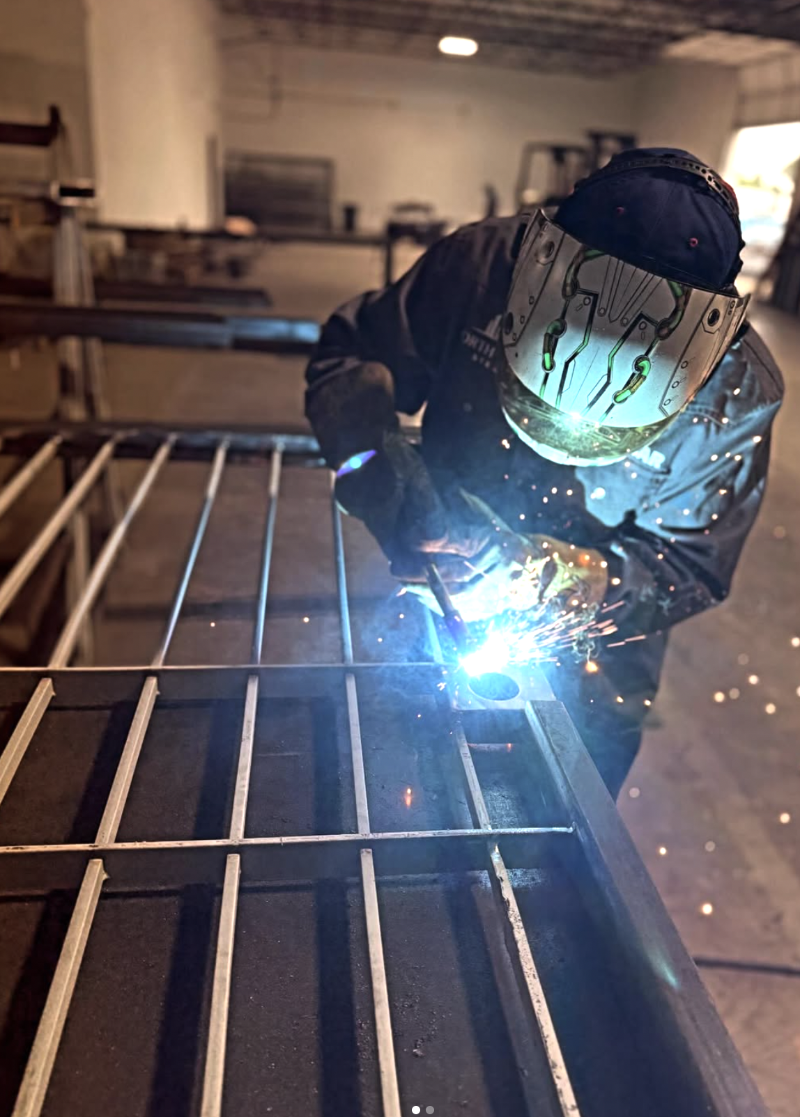 Steel fabricators welding structural steel at North Texas Steel