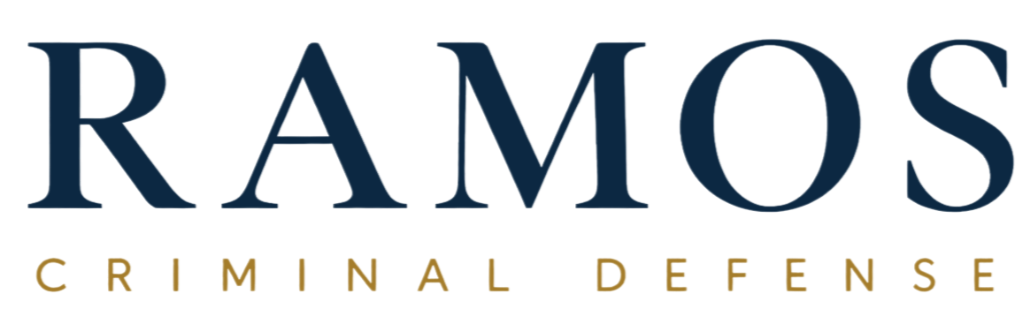 The logo for Ramos Criminal Defense, featuring the name 'RAMOS' in large dark blue letters and 'CRIMINAL DEFENSE' in smaller gold letters underneath.