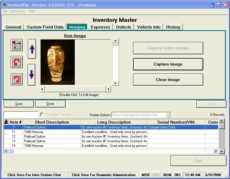 A computer screen displaying inventory management software with tabs labeled General, Custom Field Data, Imaging, Expenses, Defects, Vehicle Info, and History. The Imaging tab is active, showing an image of a decorative vase, with options to capture, clear, or edit the image. The lower part of the screen lists inventory items such as railroad spikes and a 1948 Henway, including short and long descriptions, serial numbers, and comments.