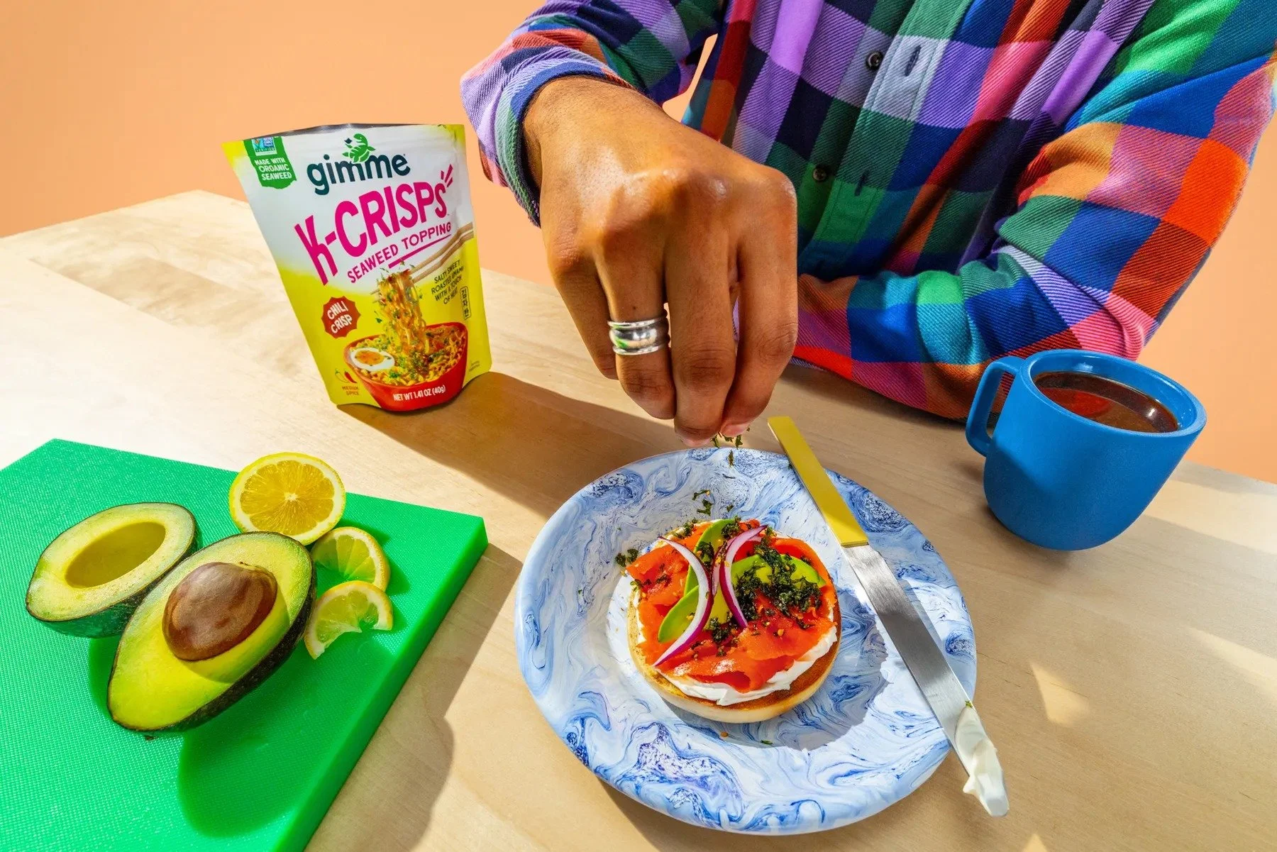 imageye___-_imgi_1_2026_JESUS_Hand-sprinkling-K-Crisps-onto-a-bagel_3803_v02_BGchange-1.jpg