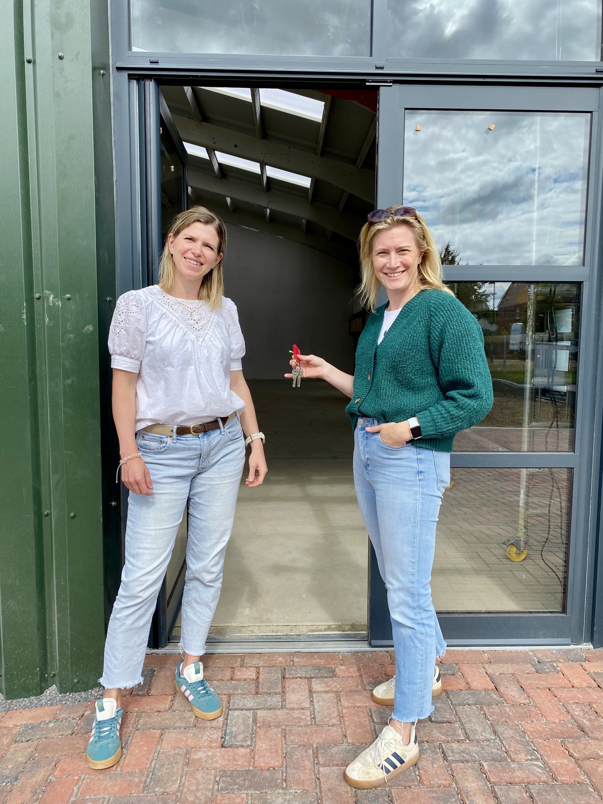 Hilary and Lizzie outside the future home of Ottie & George Vets on Jefferson Way in Thame