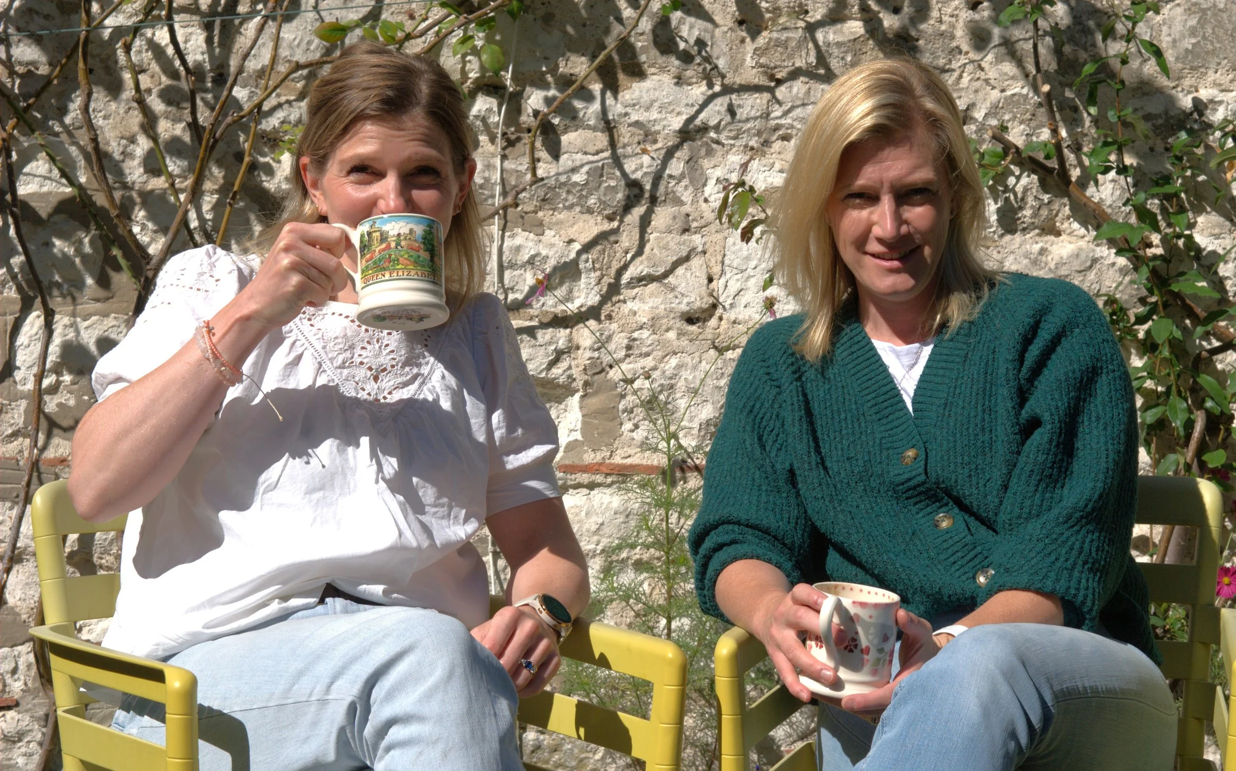 Hilary and Lizzie founders of Ottie & George Vets, having coffee together outdoors