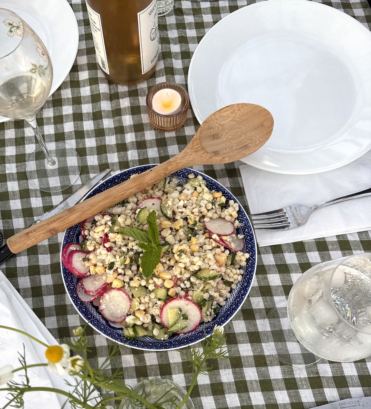 Pearl couscous salad with corn, radish, and feta